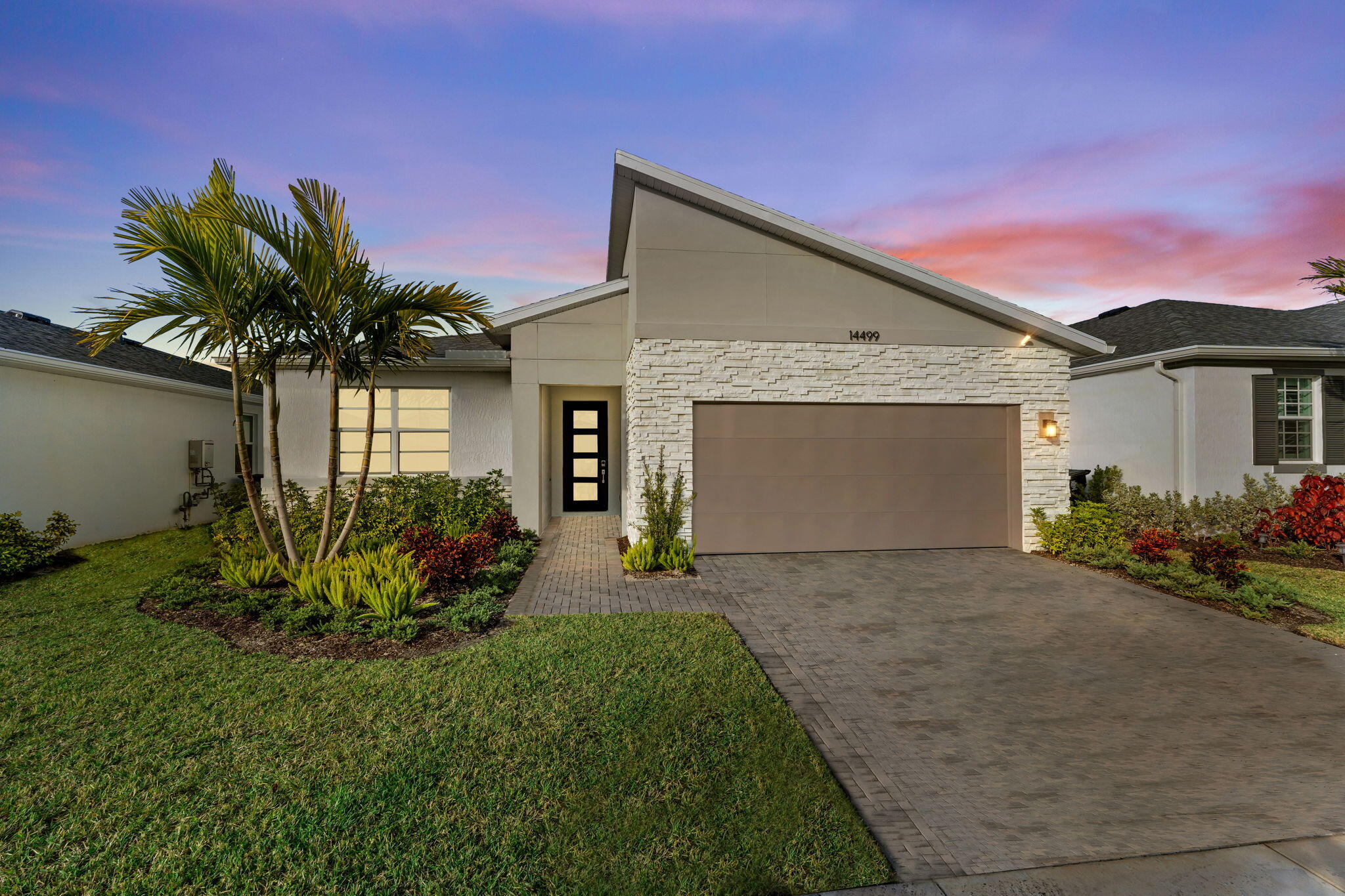 LIKE NEW 2025 CBS home in Tradition!!! Less than a year old and just steps from Tradition's newest park! Stunning Gateway model on a lakefront lot with an open, airy layout, tall ceilings, and peaceful water views. This 4-bedroom, 3-bath home features impact windows and doors, gourmet kitchen with quartz countertops, stainless appliances, gas stove, walk-in pantry, pull-out drawers, and a large island—ideal for everyday living and entertaining. Split floor plan with a private owner's suite. Enjoy the extended lanai and fully fenced backyard on the lake—perfect for relaxing or creating your dream outdoor space. Located in Cadence at Tradition with resort-style pools, scenic trails, plus nearby shopping, dining, and walking distance to Tradition Regional Park (Port St Lucie's newest park).