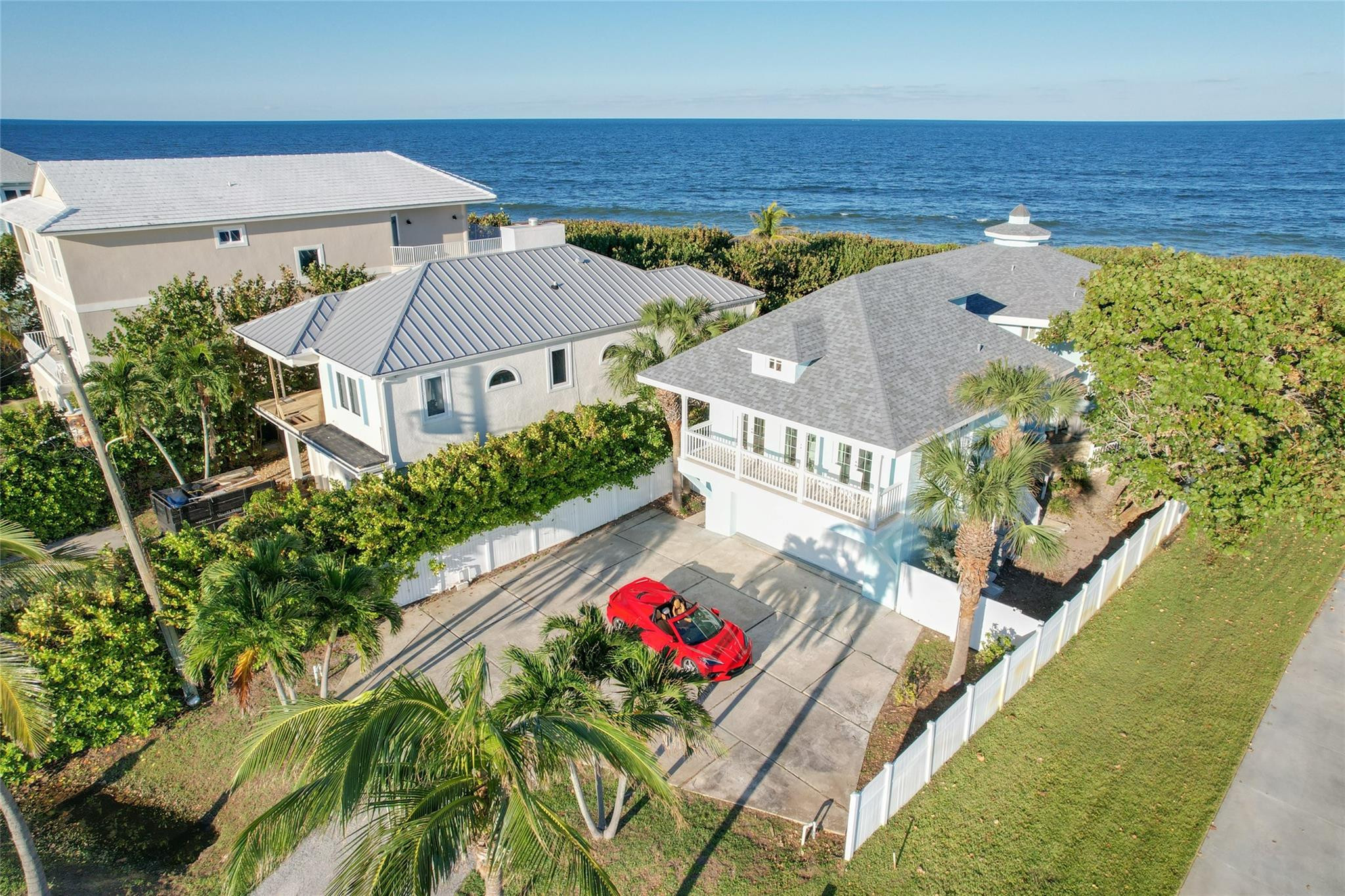 Experience the best of coastal living in this stunning ocean-to-intracoastal completely furnished/turnkey property with dock. The main residence features an open concept design with travertine flooring and impact windows and sliding doors throughout  Upstairs you will find three spacious ensuite bedrooms including a luxurious primary suite with a huge closet and private balcony overlooking the ocean. A separate guest apartment above the garage offers a full kitchen, bedroom, full bathroom and a balcony overlooking the intracoastal. The 2024 dock extends deep into the intracoastal perfect for boating, fishing or just enjoying the beautiful scenery and wildlife. It is 4x360 sf with a 10x16 terminus. A rare opportunity to own a truly exceptional coastal sanctuary with amazing sunrise/sunset.