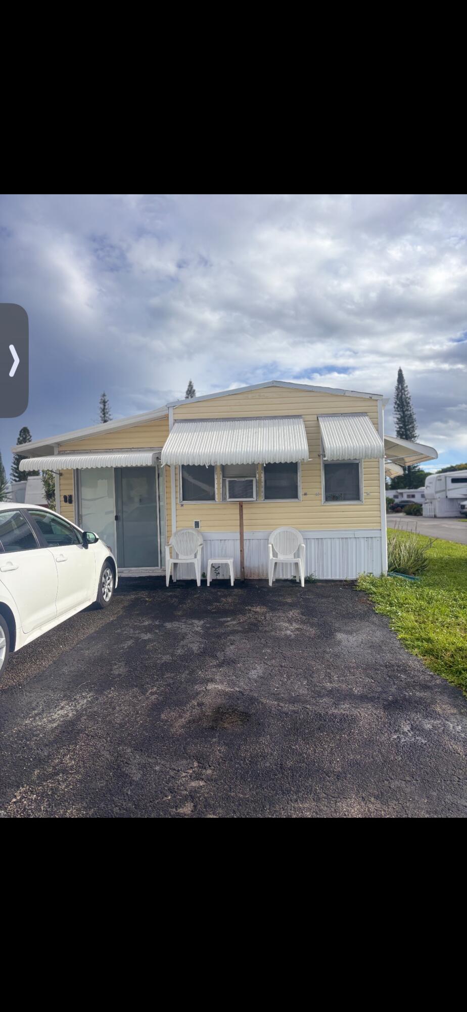 Welcome to this well-appointed mobile home located in Highland Pines Park RV in Deerfield Beach, Florida. This single-story residence offers 700 square feet of finished living space with one bedroom and two bathrooms, providing practical comfort and functionality. The floor plan is designed to maximize usable space while maintaining efficient flow throughout the home. Situated within an established community, this property presents an accessible living opportunity in a convenient Florida location. List of what will be staying in mobile home:Kitchen Microwave  Most utensils and cups Stove  Mini fridge  Dresser  Night stand  Tv in the room  Couch in the other room will be staying  Dining table and chairs  Curtains  Brown coffee table  Air fryer  Outside chairs  Grill  Outside supplies /hardware