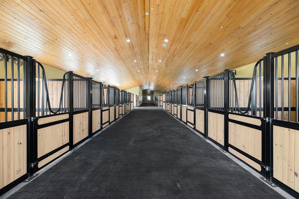 Front row location with direct horseshow access on 5.99 acres with 20 stalls! Be the first to occupy this 2015 build. All stalls are matted and include Nelson automatic waterers and Amberway Equine fans. Expansive tack room, 2 feed rooms and multiple storage areas. Oversized laundry and break room offers additional storage, full size refrigerator, ice machine and half bathroom. Owner's lounge and office is complete with full bathroom and large custom kitchen featuring gas range, wine cooler, and granite countertops. The lounge opens to a large covered patio and summer kitchen with views of the arena. An approximate 200x180 arena installed by Equestrian Footings, 6 large paddocks and multiple areas for additional buildings or a grass Grand Prix Field round out this amazing opportunity!