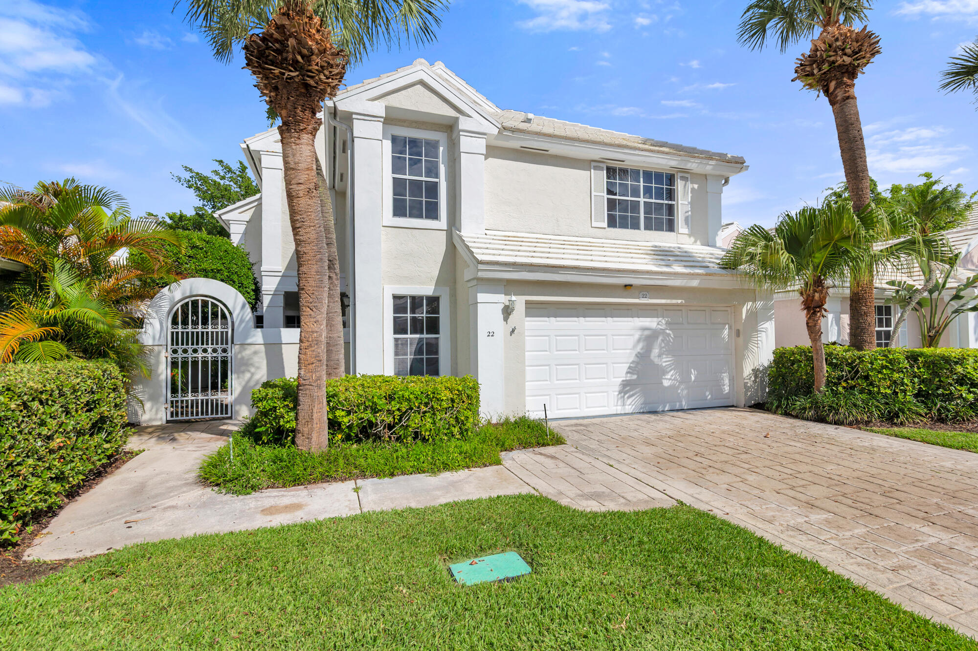 Value & Opportunity in the prestigious Barclay Club at PGA National Golf & Country Club. This light flooded 2 story 2100SF 3/2.5 (plus den) home with soaring ceilings and 2 car garage awaits your special attention to make it your own.  Unique features include a woodburning fireplace for those cozy January nights, and a screened in lanai with lap pool & spa to enjoy all year long.  Enjoy the hidden features already improved by the seller:  Pool/spa 2025; Chimney rebuilt 2025; HVAC 2018; Hot water heater 2015; Roof 2012; Garage Door 2012. Don't miss this exceptional opportunity to own a beautiful home in Palm Beach Gardens! The Barclay Club features 288 one-and-two story single family homes in a Florida contemporary and Mediterranean-inspired architectural style with light pastel exteriors and white roofs, offering a cohesive coastal ambiance.  Golf tennis and social memberships at PGA Resort & Spa are available, yet not mandatory.