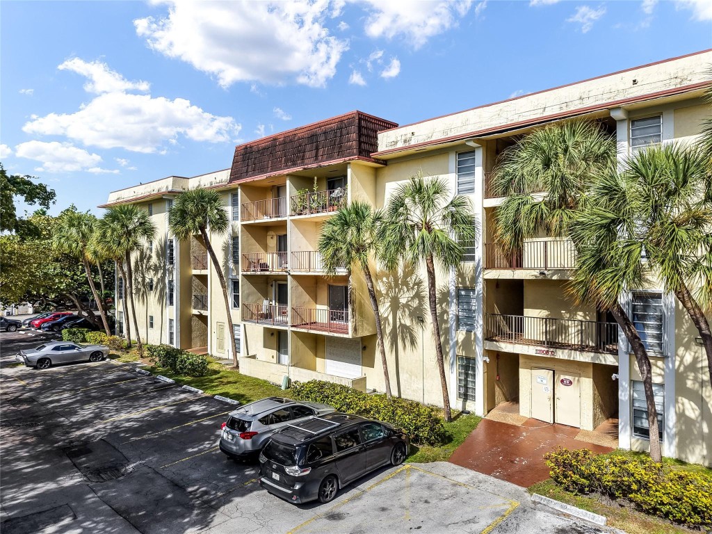 Beautifully maintained and move-in ready condo located in a tropical community. This spacious unit features a bright, open-concept living and dining area with updated flooring and abundant natural light. Sliding glass doors open to a private balcony with serene garden views.The interior offers tasteful finishes, recessed lighting, and a functional layout. The bedroom is generously sized with ample closet space,. The bathroom is clean, well-kept, and provides ample storage.Residents enjoy a peaceful courtyard surrounded by mature palm trees, creating a resort-style feel. The building offers on-site laundry facilities and assigned parking, and is conveniently located near shopping, dining, and major roadways!  Ideal for those seeking a well-cared-for property in a tranquil setting.
