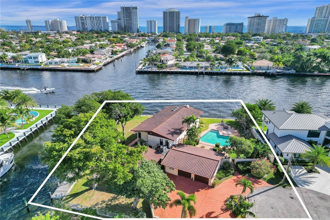 Amazing opportunity to purchase one of Ft. Lauderdale’s few Intracoastal Point Lot properties. This is a massive lot with over 21,000 sq feet making it one of the larger point lots in town. Build your dream home with forever views of the Intracoastal with your backyard having direct East exposure. The side canal offers approximately 152’ of linear waterfront with an accompanying 141’ of direct Intracoastal frontage. New homes next door and across the canal. Live in the heart of Coral Ridge with easy access to the Country Club, numerous private schools, and the beach.