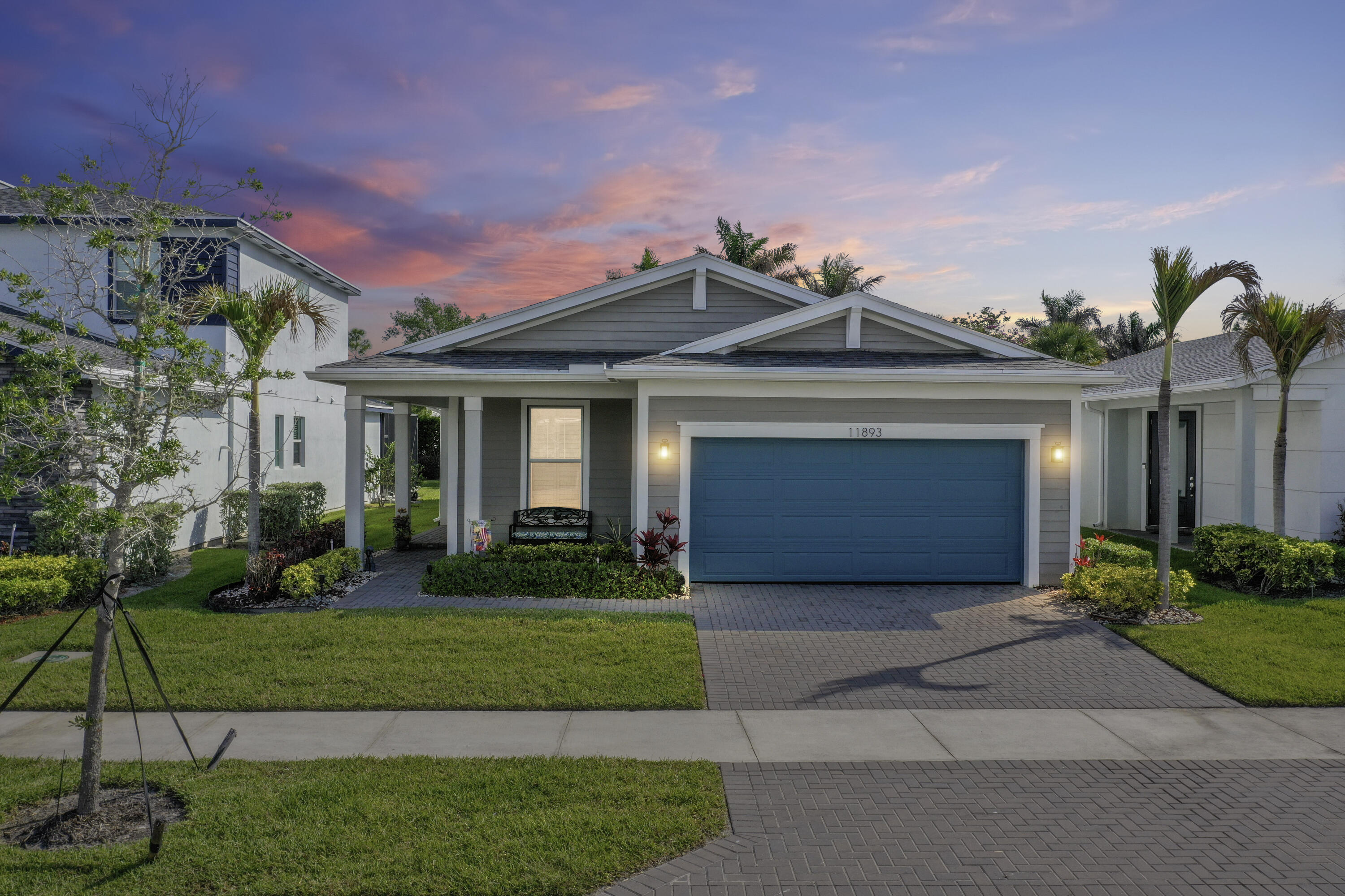 Endless natural light and low maintenance single-level living designed for comfort, style, and easy entertaining. Nearly new (2020), this elegant CBS home showcases plank tile throughout the main areas, luxury vinyl tile and crown molding in the master suite, and plantation shutters throughout. The chef-ready kitchen features matching Whirlpool stainless appliances, a convenient gas range, a large quartz island, upgraded cabinets with decorative-trim, a walk-in pantry, disposal and a tasteful tile backsplash. Simply perfect for intimate dinner parties or casual weekend mornings.  Relax in a serene master suite boasting a massive walk-in closet with customer organizers and a dual-sink quartz vanity. The guest bathroom offers a beautiful granite vanity. Thoughtful touches include impact windows and doors, ceiling fans with lights in every room, a two-car garage with epoxy floor, laundry with loads of storage, crown molding throughout the main and bedrooms, and a durable stucco exterior with gutters and concrete soffits.  Outdoor living at its best with both a covered paver porch and rear screened patio. Additional exterior features include privacy bushes lining the rear property line, a sprinkler system and sidewalks throughout the community. The HOA enhances lifestyle with a pool, fitness center, tennis and basketball courts, BBQ picnic area, dog park, included lawncare, Wi Fi and cable — ideal for active couples who value convenience, amenities and entertaining. Schedule a showing and picture evenings at home and weekends spent relaxing and exploring the community.