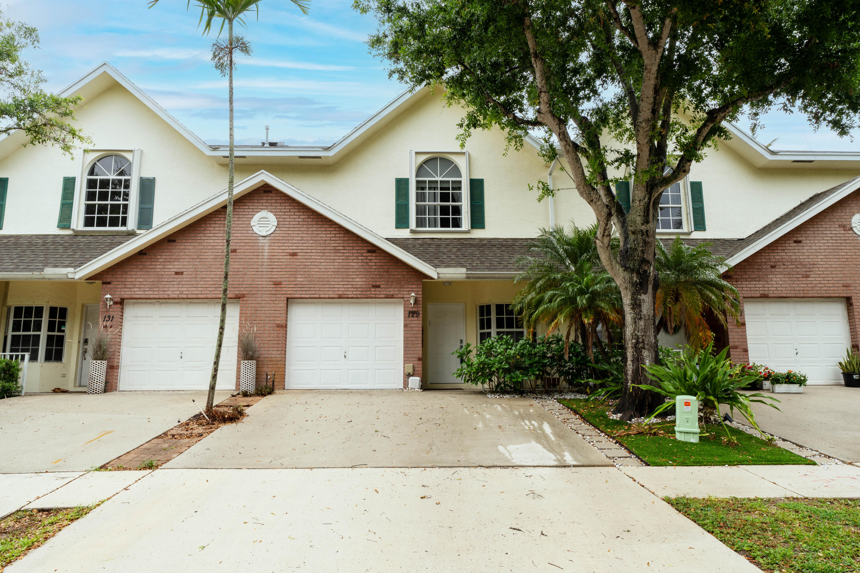A Super Rare find Townhouse in the gated Cedar Ridge Estates, spacious 3-bed, 2.5-bath with 1-car garage. This unique home includes a finished basement ideal for an office, a 4th bedroom, storage, or gym. Residence is also equipped with a central vacuum system, accordion shutters on the upper windows, panels on the 1st level, and an Argentine outdoor grill. This gorgeous home features an open-concept kitchen/dining area, an upgraded and redesigned kitchen, and Stair Railings. Also, high-quality wood floors, tile floors, and soaring ceilings. The primary bath offers his & hers sinks and a walk-in glass shower. Conveniently located near I-95, shopping centers, dining, beaches, and within walking distance to Lake Worth Christian School and Imagine Chancellor Charter School. Clubhouse, Pool.