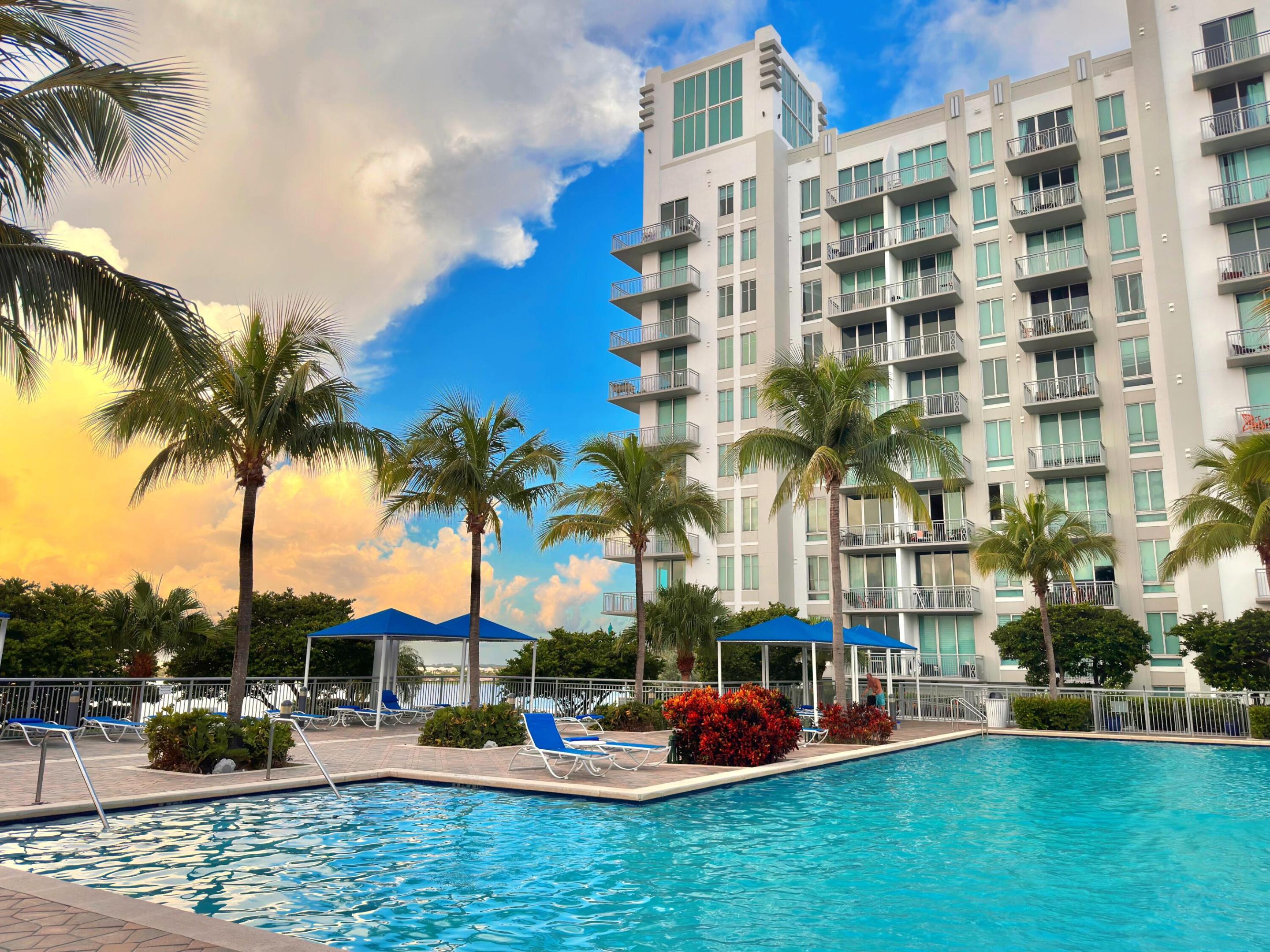 AVAILABLE JULY 1ST / NO LAST MONTH RENT UPFRONT.  Breathtaking views over Clear Lake, Swimming pool and Downtown West Palm Beach from this pristine top floor penthouse condo with 12 ft ceiling! This unit has been completely refurbished with beautiful Austen Oak flooring and fresh paint. It offers floor to ceiling impact windows, in-unit laundry, fully appointed kitchen with granite counters and stainless appliances. In addition to enjoying gorgeous views from your balcony, the building provides a community pool & spa, pool deck and grilling area, game room, fitness room, walking path, business center, private gated garage and manned lobby with 24/7 security. High speed internet is included. Intercostal, Rosemary Square, Kravis Center, Flagler Drive, and all the shops and restaurants.