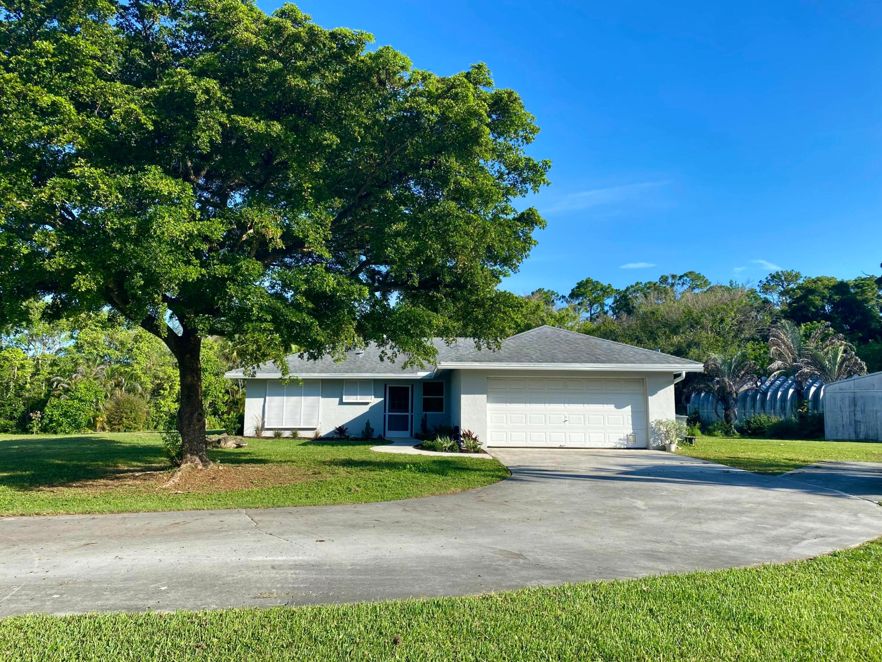 Welcome to this well-maintained CBS home situated on 1.65 private acres on a paved road. This 3-bedroom, 2-bath residence features vaulted ceilings, a cozy fireplace, an updated kitchen, and a beautifully renovated guest bathroom. The 2016 roof offers added peace of mind, while the spacious screened porch provides the perfect place to relax and enjoy the property. Outside, you'll find two detached outbuildings ideal for storage, hobbies, or a workshop, along with mature fruit trees and plenty of room to spread out. Complete with a 2-car garage and located in an area served by A+ schools, this property offers the perfect blend of comfort, space, and convenience.