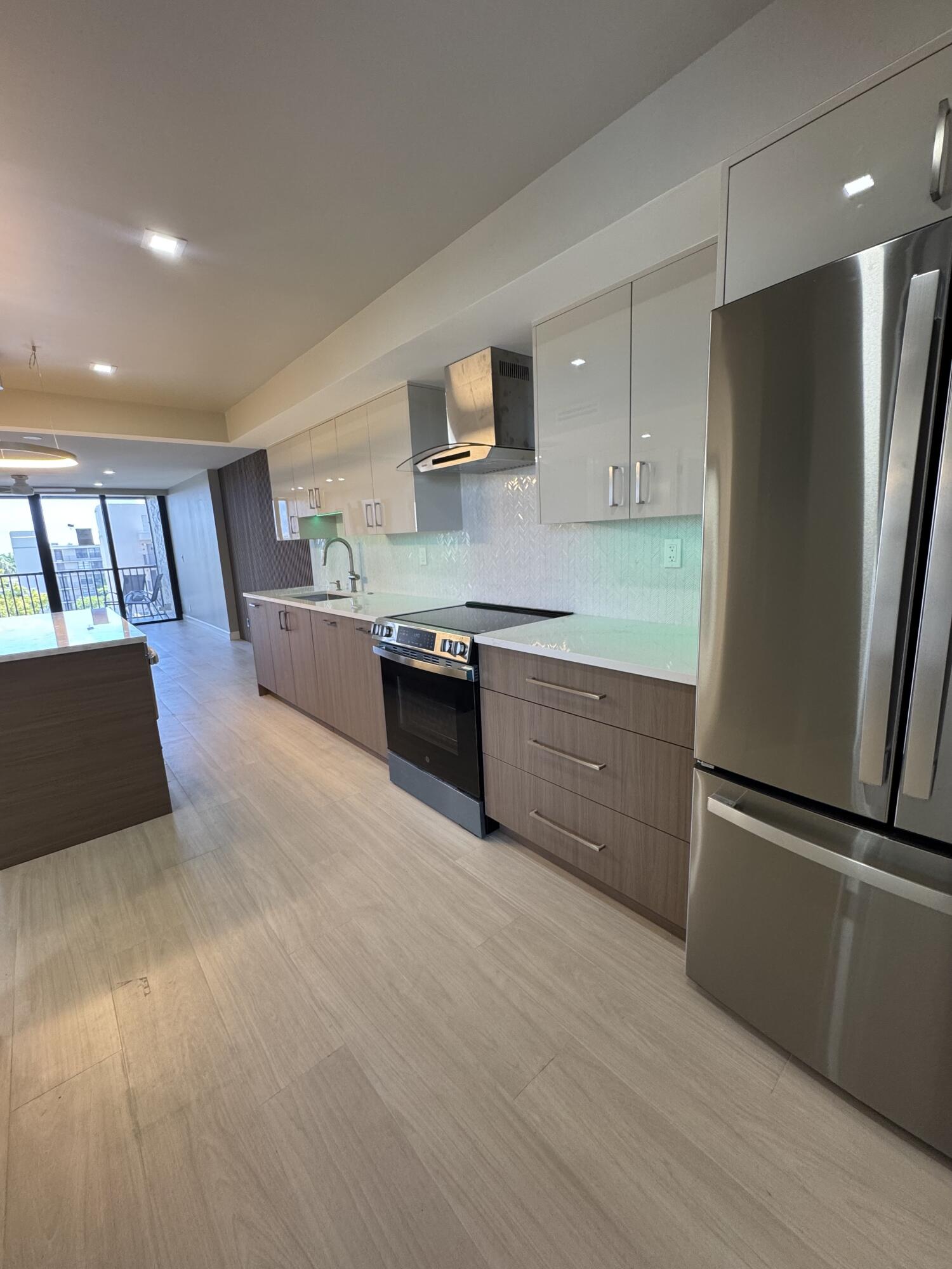 WOW! COMPLETELY DECORATOR RENOVATED PENTHOUSE! ALL NEW IMPACT SLIDING DOORS & WINDOWS WITH WATER VIEWS! ALL LUXURY UPGRADES INCLUDED DELUX GE PROFILE  APPLIANCES, NEW CUSTOM CABINETRY, QUARTZ COUNTERS, HUGE CENTER ISLAND WITH MICROWAVE DRAWER.  NEW PORCELAIN FLOORS & MOLDING.  NEW QUARTZ BATHROOM VANITIES, NEW TILE SHOWERS, GLASS DOORS & CUSTOM CABINETRY. NEW AC'S & DUCTWORK! ALL NEW ELECTRIC & LIGHTING, DECORATOR ACCENT WALLS. ENCLOSED PATIO!   DOCKS AVAILABLE! GUARD GATED COMMUNITY WITH CLUBHOUSE, 5 POOLS, TENNIS ALL IN FABULOUS EAST BOCA LOCATION! ALL ASSESSMENTS & CONCRETE RESTORATION COMPLETED AND PAID FOR BY SELLER APPROX $150,000 IN RENOVATIONS! MOVE RIGHT IN!