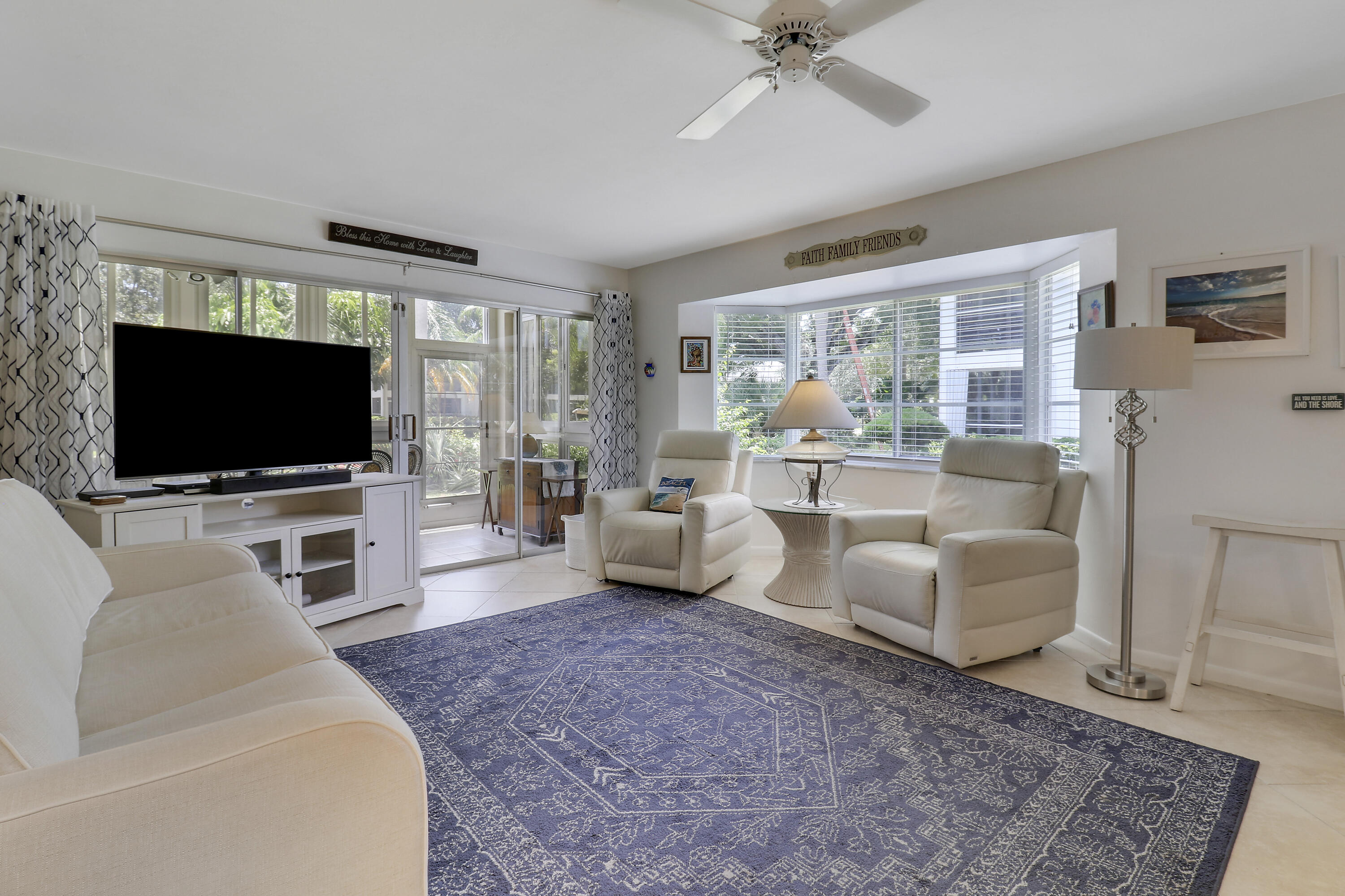 Only available ground-floor end unit in the sought-after Tequesta Gardens community. This light-filled 2-bedroom, 2-bath condo features an updated kitchen, new roof, newer A/C, and a newer electrical panel. The spacious living area opens to a bright enclosed porch, perfect for relaxing or entertaining year-round. Both bedrooms are generously sized, with abundant storage and a walk-in closet in the primary suite. Residents enjoy exceptional amenities including two pools, a putting green, shuffleboard, and a clubhouse with a full kitchen and BBQ area. Ideally located within walking distance to coffee shops, restaurants, and shopping. Monthly dues include basic cable, water, sewer, exterior maintenance, and insurance.