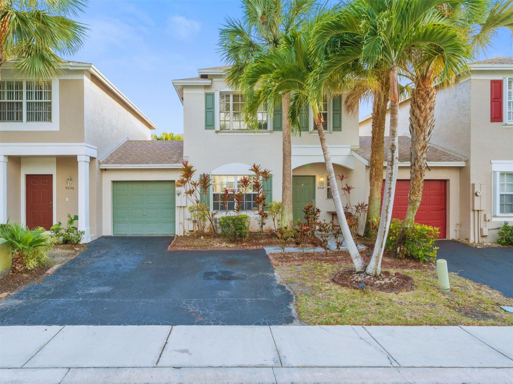 Fully updated "Plum Harbor Retreat" in Tamarac. This move-in-ready townhouse features a rare brand-new gas kitchen with quartz countertops and premium appliances. Unique floorplan offers 2 spacious bedrooms, each with its own private en-suite bathroom, plus a convenient half bath downstairs. The interior boasts soaring vaulted ceilings and an open layout flooded with natural light. Enjoy a private, fully fenced backyard with updated decking and a large screened-in porch flex space. One-car garage + oversized driveway. Plum Harbor amenities: private pickleball courts, clubhouse, and pool. Low HOA includes exterior maintenance and roof coverage, allowing buyers to save significantly on insurance and long-term maintenance. No rental restrictions—ideal for investors. FHA/VA-friendly.