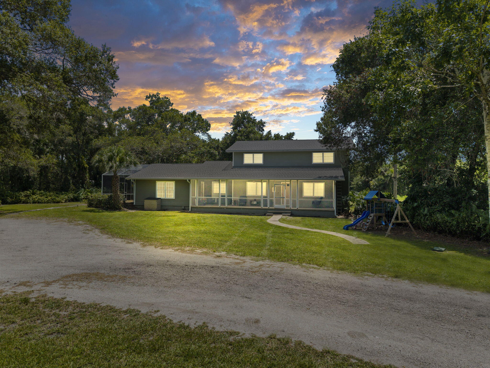 Rare opportunity to own a spacious 4-bedroom, 3.5-bath home nestled on 4 beautiful acres in desirable West Fort Pierce. Surrounded by majestic Old Florida oak hammocks, this property offers privacy, natural beauty, and endless possibilities. Enjoy Florida living with a pool, while the barn and expansive grounds provide ample space for livestock, equipment, a workshop, boat storage, RV parking, and more. The AG-2.5 zoning allows for a variety of agricultural and residential uses, making this an excellent opportunity for hobby farming, equestrian pursuits, or a home-based agricultural business. Ask for details on permitted AG-2.5 uses. Large bonus room with full bath could be used as a guest sweet for extended family.
