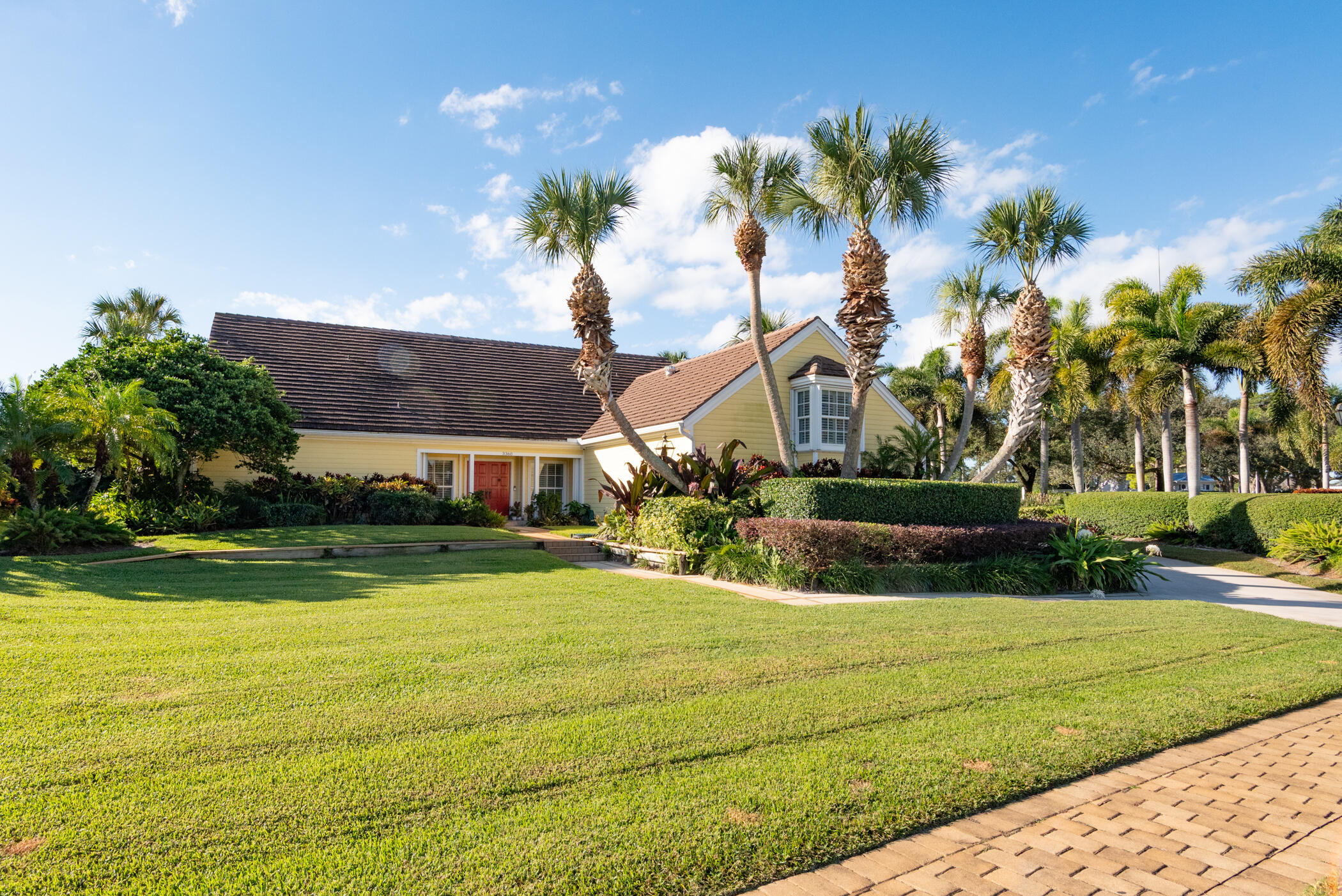 Priced to Sell!  Enjoy golf course living at its best in this spacious two-story home set on the 16th Fairway in the sought-after Yacht & Country Club of Stuart.  With 4,898 Square Feet under air and 5,424 Total Square Feet, this well-maintained residence offers four bedrooms, five full baths, and one half bath, with plenty of room to live, entertain, and unwind.  The main-level primary suite is designed for comfort and privacy, featuring generous closet space, separate his-and-her bathrooms, and direct access to a private office. The home has Hurricane rated impact windows, Accordion shutters, and Security System too for your safety and protection.  The Living Room sliders open to an enclosed patio, creating an easy indoor-outdoor flow—perfect for enjoying peaceful golf views. Landmark Estate on the 16th Fairway — Yacht & Country Club of Stuart Nearly 5,000 square feet under air at $204 per foot — a price point that's increasingly rare for a four-bedroom estate home of this size on a premier Stuart golf course lot.  Set directly on the 16th fairway in the Yacht & Country Club of Stuart, this two-story residence offers four bedrooms, five full baths, and a half bath across 4,898 square feet of thoughtfully designed living space — with 5,424 total square feet under roof. The lot itself is one of the most distinctive in the community, with a private pool, mature landscaping, and unobstructed golf course views that anchor the entire backyard.  A primary suite built for two. The main-level primary suite is designed around the way couples actually live — separate his-and-her bathrooms, generous walk-in closet space, and direct private access to a dedicated home office. It's a layout that works equally well for dual-professional households, retirees who value their own space, or anyone who's tired of compromising on one shared vanity.  The great room delivers the wow moment. Vaulted ceilings with exposed wood beams, matching Casablanca ceiling fans, and an expansive wall of hurricane-impact windows and sliders open directly to the pool deck — creating the kind of indoor-outdoor flow that defines Florida living at its best. The Living Room sliders extend that experience to an enclosed sunroom, with private pool setting and on the Golf course.  Built for Florida — and built to last. Hurricane-rated impact windows throughout, accordion storm shutters, and a monitored security system mean the home is ready for the season the moment you arrive. No retrofit projects, no insurance friction.  The upstairs is its own retreat. Two spacious en-suite bedrooms with double vanities and ample storage anchor the second floor, joined by a third private suite — complete with its own bathroom, walk-in closet, and sitting area — that functions beautifully as a guest wing, an in-law setup, or a teenager's private space.  Entertaining is built in. A separate family room with a dedicated wine closet and bar area, a two-car garage, and the pool/patio configuration make this home one of the most genuine entertainers in Yacht & Country Club. Whether you're hosting a foursome after a round on 16, a holiday gathering, or a quiet evening with a glass of wine and a view of the fairway, the layout flexes to match.  Yacht & Country Club of Stuart — and what it actually means. YCC is one of Stuart's most established private golf communities, with a member-owned course, dining, tennis, and yacht facilities on the St. Lucie River. For golfers, it's a serious club with a serious course. For everyone else, it's a tight, social, member-driven community with the kind of long-tenured neighbors that newer developments simply can't manufacture.  The bottom line. For a buyer looking at $1.2M-$1.6M renovated homes nearby with smaller footprints, this is a meaningful opportunity — more space, a better lot, the same community, and room to put your own finishes into a home that's been genuinely well cared for over the years.