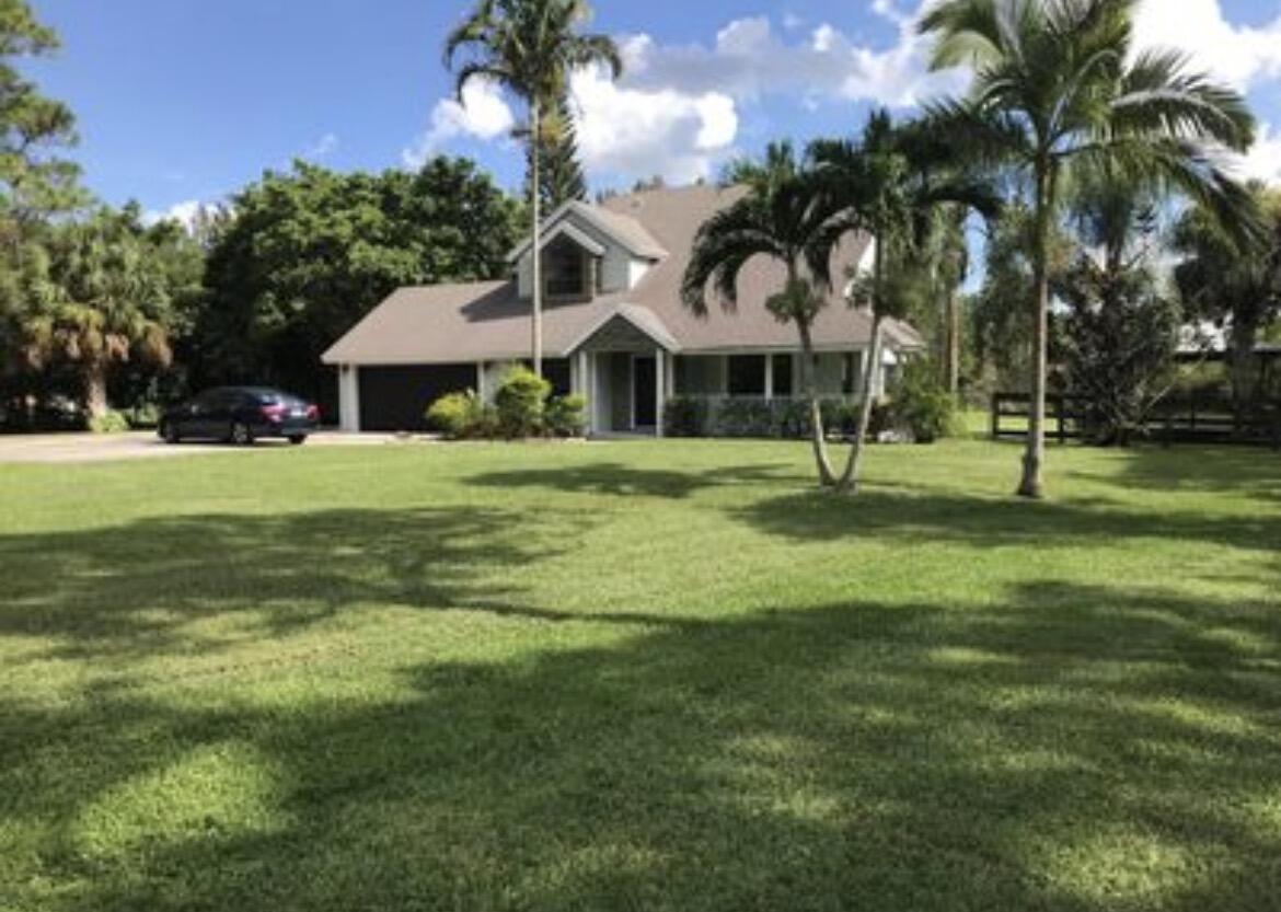 ON PAVED ROAD! CLOSE TO STATE RD 7. 4/3 TWO STORY HOME ON A SPECTACULAR BACKYARD THAT SITS ON 1.25 ACRE! BRING YOUR BOATS AND RVE'S. BRAND NEW A/C.REMODELED BATHROOMS, NEW 26 X 26 PORCELAIN TILES, LAMINATE WOOD UPSTAIRS, 3 BEDROOMS UPSTAIRS AND ONE DOWNSTAIRS, S/S APPLIANCES,GRANITE COUNTERS.FRESHLY PAINTED GARAGE. MAN MADE SMALL POND ON YARD AND CANAL ON THE BACK, GAZEBO IN BACKYARD.  WELL-MAINTED TWO-STORY HOME FEATURING A NEW ROOF INSTALLED IN 2020. IMPACT-RESISTANT WIDOWS ARE INSTALLED THROUGHOUT THE FIRST FLOOR, WITH AN ADDITIONAL IMPACT WINDOW IN THE UPSTAIRS FRONT-FACING ROOM. THE HOME OFFERS SPACIOUS LIVING AREA, ABUNDANT NATURAL LIGHT, AND FUNCTIONAL FLOOR PLAN. COVENIENTLY LOCATED NEAR SHOPPING, DINING, SCHOOLS, PARKS, AND MAJOR HIGHWAYS. A GREAT OPPORTUNITY FOR BUYERS SEEKING CO **HOME WARRANTY PROTECTION COVERAGE  HOME SYSTEMS AND APPLIANCES AND HVAC SYSTEMS***