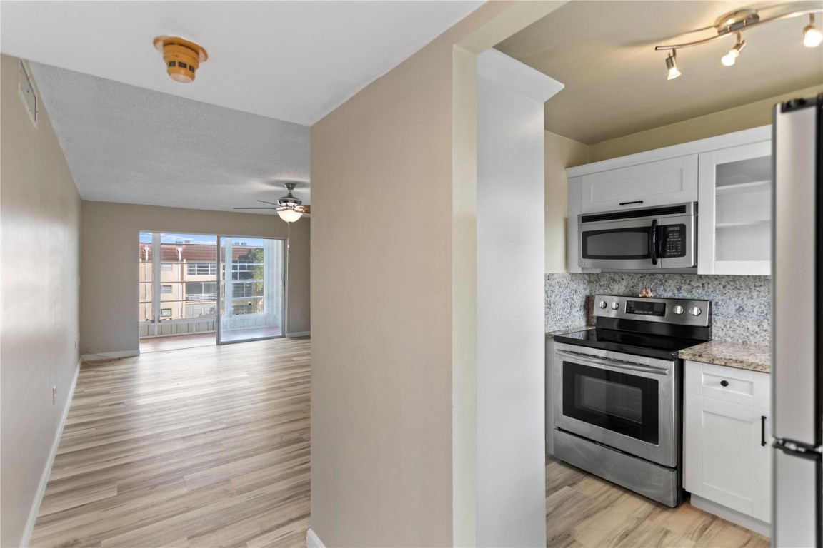 Welcome to this charming and move-in-ready 1-bed, 1-bath, in the desirable Sunrise Lake Condominium, a well-maintained 55+ community. This vacant unit is situated on the third floor and offers easy access via elevator, providing both comfort and convenience. The home has been recently remodeled and features a brand-new kitchen with modern cabinetry and new appliances, complemented by new laminate flooring throughout. The ac system was replaced approximately 2 years ago, offering energy efficiency and peace of mind. Positioned on a corner lot, the unit enjoys peaceful lake views, creating a serene and relaxing atmosphere. Being located in Phase 3 of Sunrise Lake. Sunrise Lake is known for its quiet surroundings, and proximity to shopping, dining, medical facilities, and major roadways