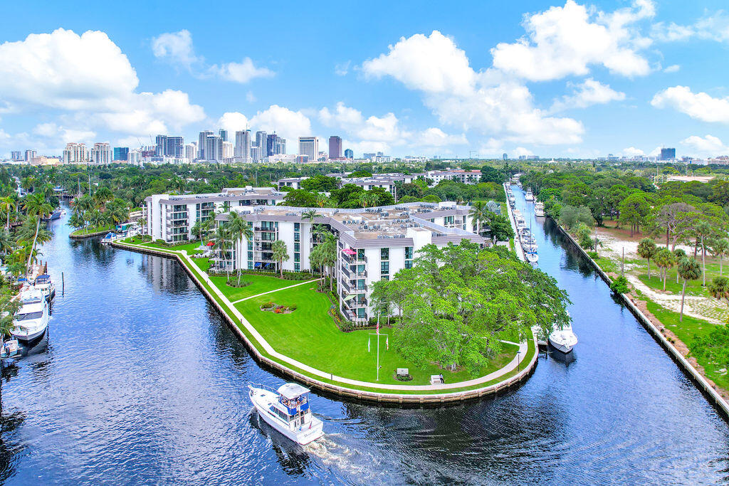1 bedroom, 1 1/2 bath condo with sunny Southern view of trees, fountain & South canal.  Updated kitchen with granite countertops.  Large bedroom with large walk-in closet and closet system.  River Reach completed a major project with new impact sliding glass doors, new exterior paint, new exterior lighting, new landscaping, concrete restoration/new balcony railings and more!  Buyer benefit - all of the above improvements already paid for by seller!  Private waterfront island with 24 hr manned guardhouse, 3 heated pools, tennis/pickleball, fitness center & kayak /paddleboard racks.  2 pets under 20 lbs each permitted, dockage up to 50' as available at $48.90/ft/per year! Great central location minutes to downtown/Las Olas, beaches, restaurants, shopping, Performing Arts, Port, Airport and  all major expressways!