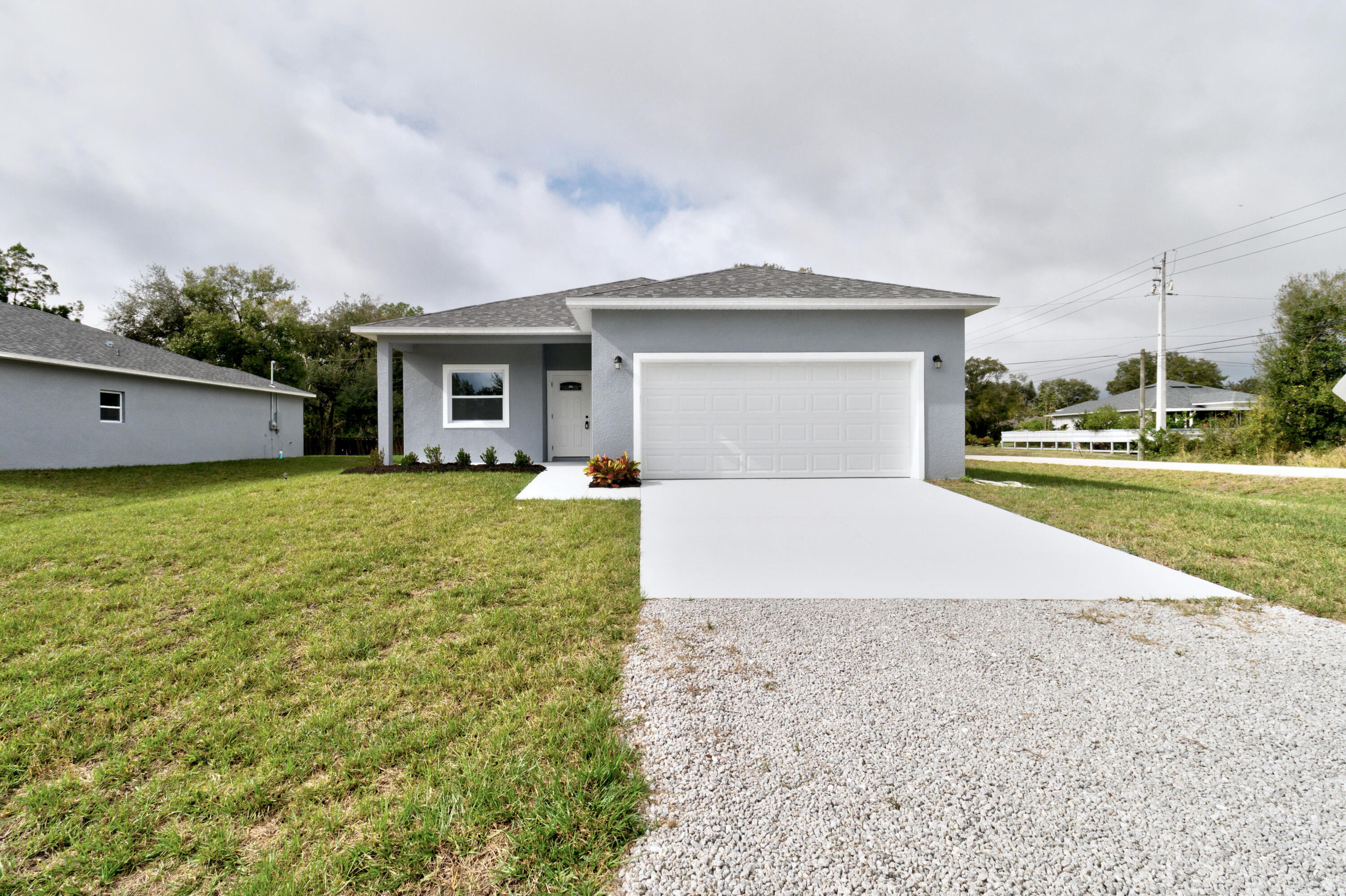 WELCOME HOME-2025 built CBS split floorplan home! BEAUTIFUL kitchen with quartz countertops and Frigidaire SS appliances, windowside breakfast nook, pantry & 5 burner stove. The GREAT room offers space for dining and living...or whatever fits your lifestyle. ALL impact windows and doors,Vinyl floorings throughout, 9+foot ceilings. Primary bedroom has walk in closet, dual sinks, large step in shower. Otherside has 2 bedrooms & guest bath +large laundry room, recessed lighting, ceiling fans and much more. Nice large garage, with pull down attic storage. On county water, 1st home off paved road COMES WITH NEW BUILD WARRANTY COMES WITH NEW BUILD WARRANTY