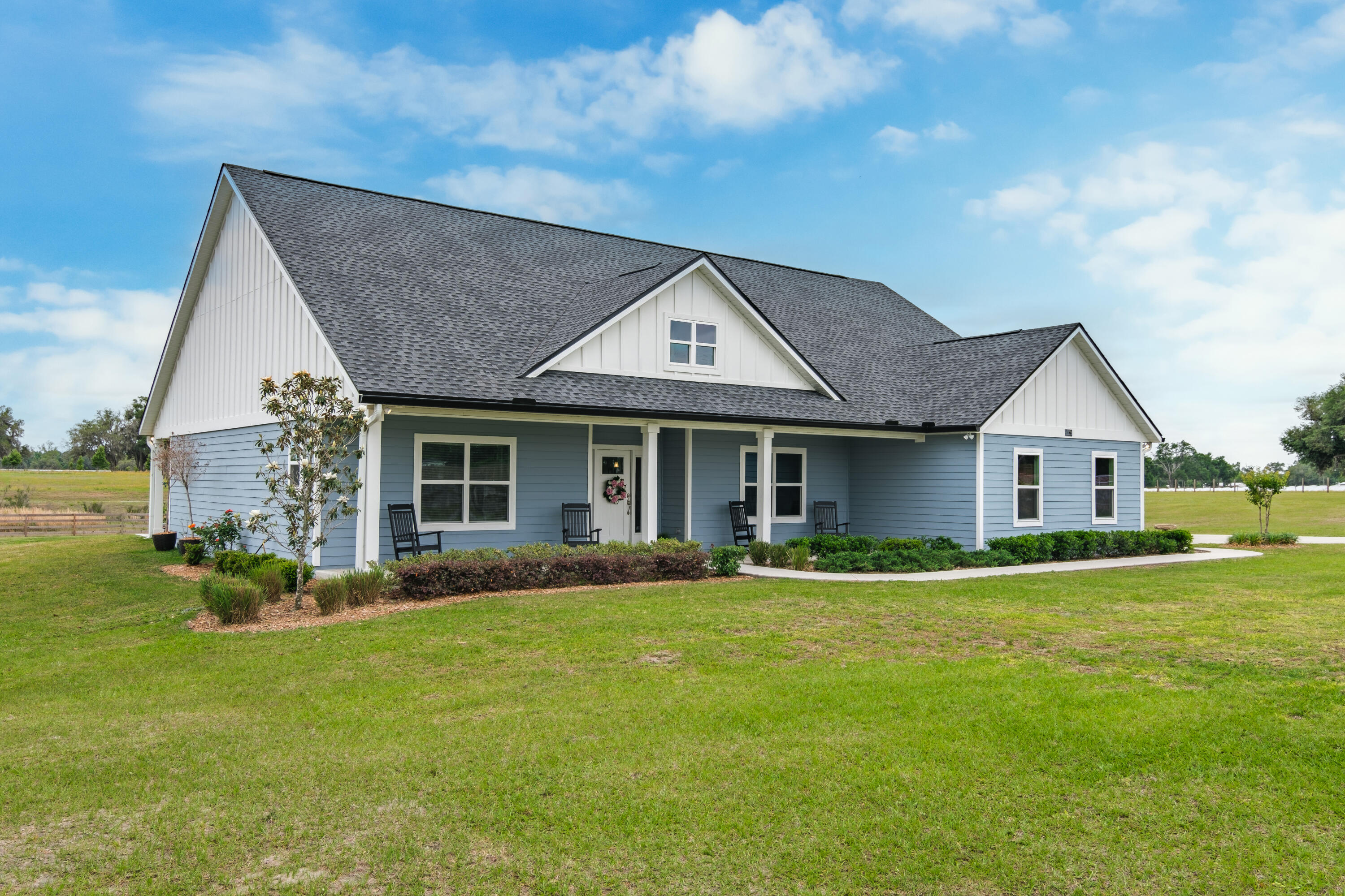 Pristine 3-bedroom, 2-bathroom sanctuary features a sleek 2-car garage and meticulously cross-fenced grounds designed for the equestrian enthusiast or the adventurous soul.  This property offers rare option to purchase additional fenced 1 acre lot connected to property and maintain your private sanctuary, develop a second luxury residence, or capitalize on the vacant acre. Experience the ultimate blend of rural serenity and urban convenience, located just moments from the heart of downtown Live Oak.