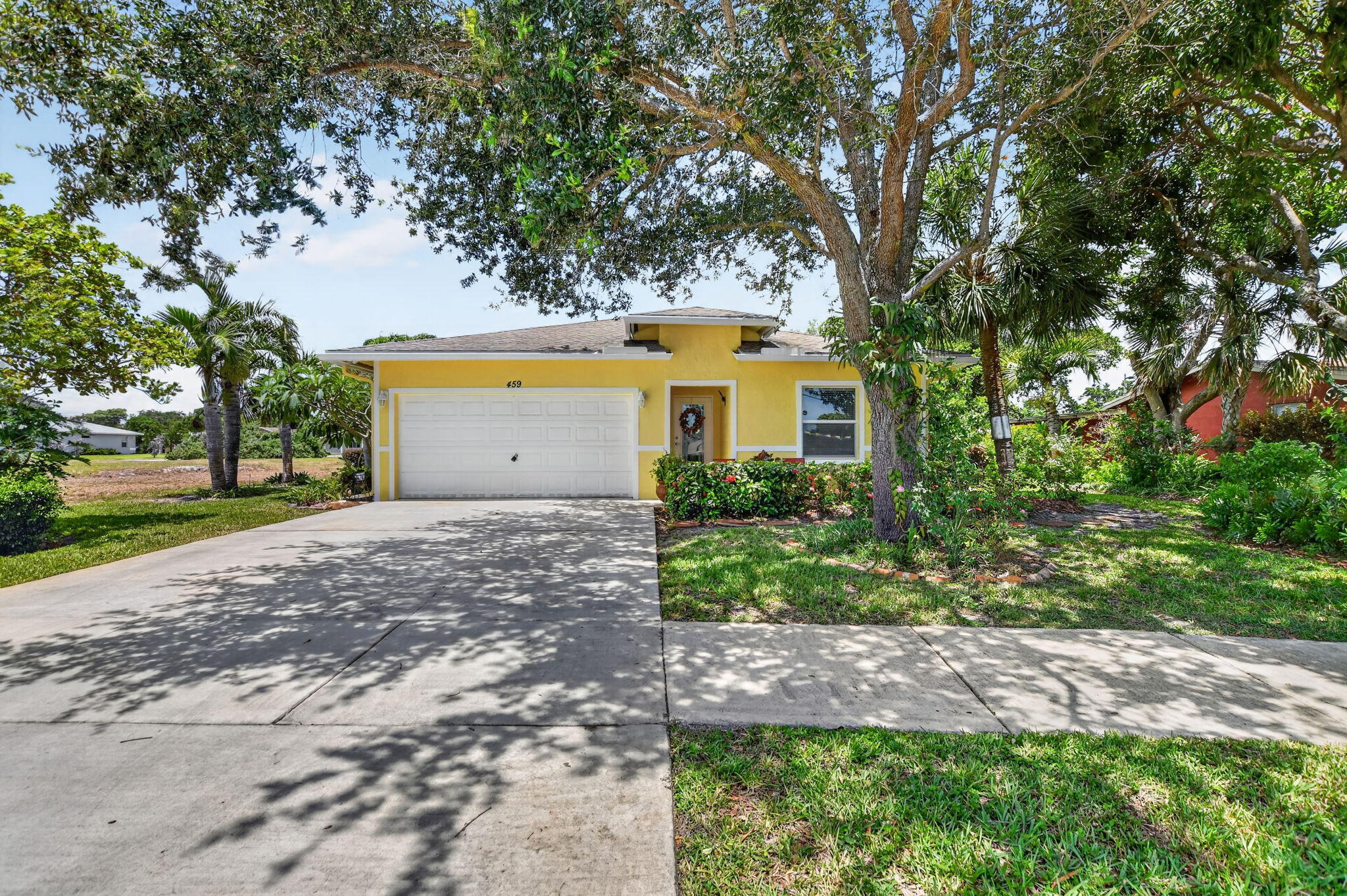 3 Bedroom 2 1/2 bath single family home. Vaulted ceilings, ceramic tile in all living areas, high hats through out, impact windows and doors, fans, all appliances including a chest freezer, sprinklers on a well, granite counter tops, attic steps for storage, over sized 2 car garage with a utility sink, out door shower and a lush inland tropical yard with fruit trees and a amazing assortment  of tropical fruit bearing plants.