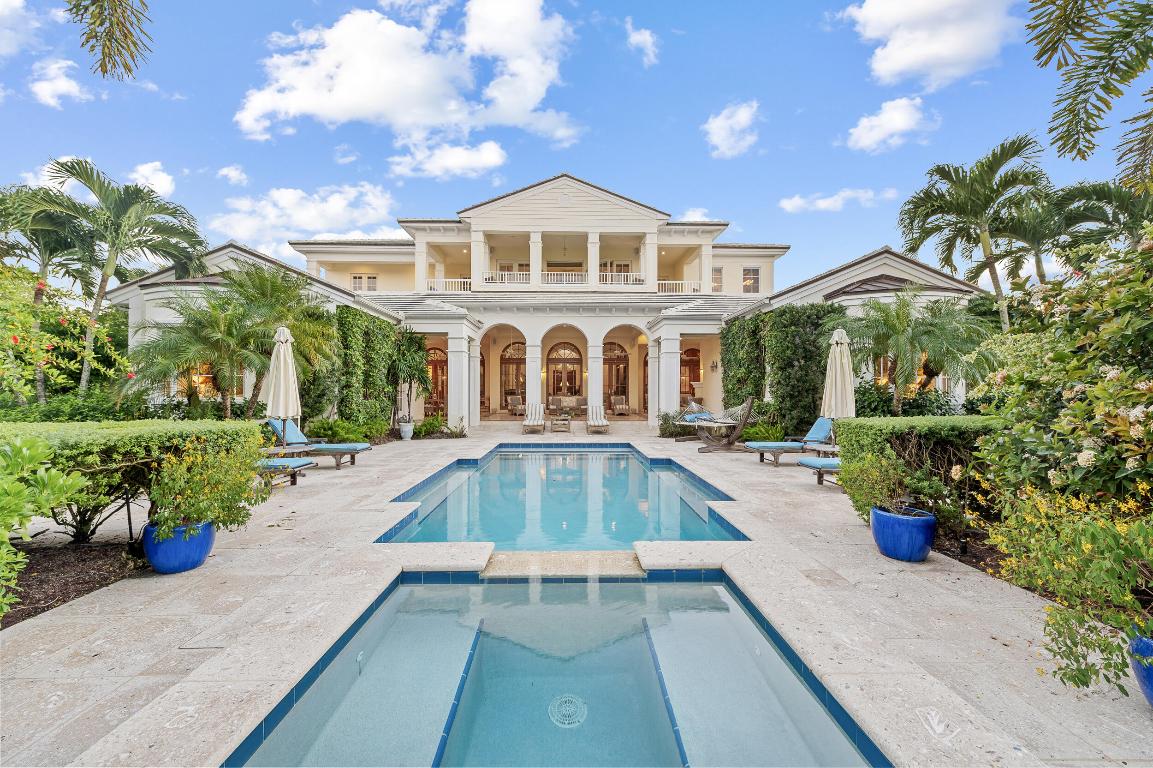 Situated within the exclusive community of Sailfish Point, this exceptional waterfront estate showcases 252 feet of direct water frontage with immediate ocean access. Set on a spacious corner lot, the property offers complete privacy and features a well-equipped dock- perfect for enjoying the South Florida lifestyle. 

 The living spaces combine comfort and elegance, featuring 4 bedrooms, 5 full bathrooms, and 2 half baths. A custom bar and multiple fireplaces enhance the living room, while the spacious, bright kitchen offers an ideal space for dining and entertaining. Large french doors connect the interior to a generous covered terrace, creating a seamless indoor-outdoor flow. The entire second level is devoted to the primary suite, providing a private retreat with a spacious bedroom, dual bathrooms and walk-in closets, a sitting room, office, studio, and a balcony capturing magnificent water and garden views.

Two oversized guest suites sit on each side of the main patio, each with its own kitchenette- offering privacy, comfort and convenience for visitors. A bonus room adjacent to the patio provides additional flexibility, perfect for a home gym, yoga studio, or creative workspace. The property also includes a two-car garage with dedicated golf cart space, and a home generator.

Living in Sailfish Point provides unparalleled convenience and amenities. Residents enjoy an oceanfront clubhouse, multiple dining venues, tennis and pickleball courts, an 18 hole Jack Nicklaus Signature golf course, state-of-the-art fitness and spa facilities, private beach access, full-service marina, and 24/7 gated security. Enjoy this opportunity to experience life within one of Florida's most prestigious communities.