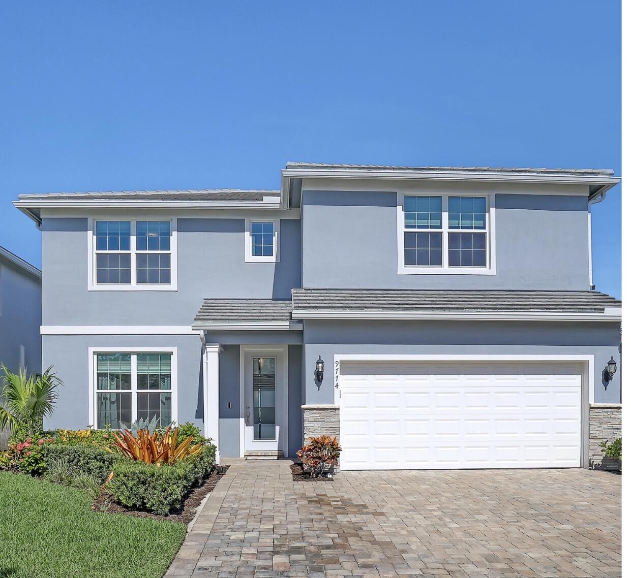 Why wait to build when this beautifully appointed Whitestone home is ready for you today? Inspired by the elegant design of the builder's Whitestone model, the owners thoughtfully appointed this home with premium finishes and custom enhancements to create a residence that is both sophisticated and welcoming—offering everything buyers love about new construction without the wait. From the moment you step through the front door, your eyes are immediately drawn to the sparkling lake views beyond the open, light-filled living spaces. Soaring ceilings, wood-look ceramic tile, and carefully selected finishes create a warm yet refined atmosphere that instantly feels like home. At the heart of the home, the beautifully appointed kitchen naturally becomes the gathering place. Premium 48-inch cabinetry, quartz countertops, a contrasting center island with pendant lighting, and a spacious walk-in pantry combine timeless style with everyday functionality. A versatile flex room offers endless possibilities as a home office, reading room, sitting area, or playroom. When the day comes to an end, retreat to the first-floor primary suite featuring a spa-inspired bath with an oversized floor-to-ceiling tiled shower, dual shower heads, and a custom-designed walk-in closet. Upstairs, a generous loft creates the perfect second living area, complemented by three additional bedrooms and a full bath. Designed for both relaxation and entertaining, the custom pool becomes the centerpiece of the backyard. Whether you're cooling off on a warm Florida afternoon, enjoying a good book from the spacious sun shelf, hosting friends on the expansive paver patio, or simply taking in the peaceful lake views, every day feels a little more like a vacation. As the sun begins to set over the lake, the shimmering water becomes the backdrop to evenings spent unwinding beneath the covered lanai. Additional features include retractable sliding glass doors, PGT WinGuard Low-E impact windows, Smart Home technology, premium Samsung washer and dryer, upgraded laundry room with overhead cabinetry and utility sink, and transferable builder warranties for added peace of mind. Resort-style amenities include a beach-entry pool with lap lanes, private cabanas, the Barefoot Bar, clubhouse, tennis and pickleball courts, basketball court, playground, dog park, fire pit, grilling area, event lawn, community gathering spaces, and movie nights by the pool. Families will appreciate the private rear entrance providing golf cart, bicycle, and walking access directly to the high school without leaving the community.