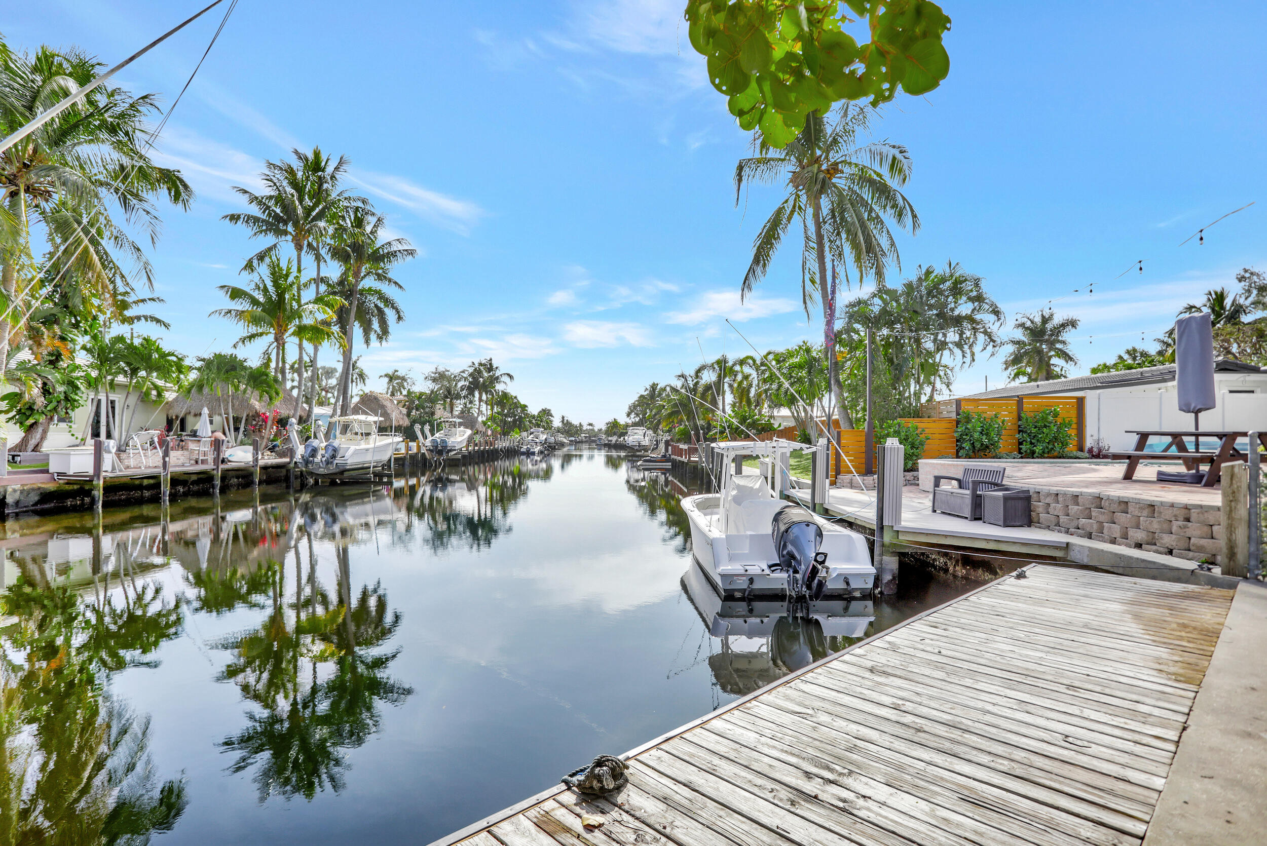 AVAILABLE 4.21.26 This COMPLETELY RENOVATED 3BR/2BA POOL home with a DOCK is nestled at the end of canal with OCEAN ACCESS. An additional bonus room can be used as an office/den/playroom or even a 4th bedroom. Relax by the pool & entertain on the large paver patio after a day on your boat. Located on a corner lot it offers an extra fenced yard area - great for pets, kids or additional entertainment. A quiet oasis and yet close to I-95, restaurants and shopping. About .5 mile away is a shaded public park with a playground, tennis, handball, walking trails & covered picnic area. The Pompano Beach Pier and beaches are just a little over 2 miles. All newer appliances and AC. Complete IMPACT WINDOWS. Pet friendly. INTERNET, POOL and LAWN maintenance are included. Ready for you to call it home!