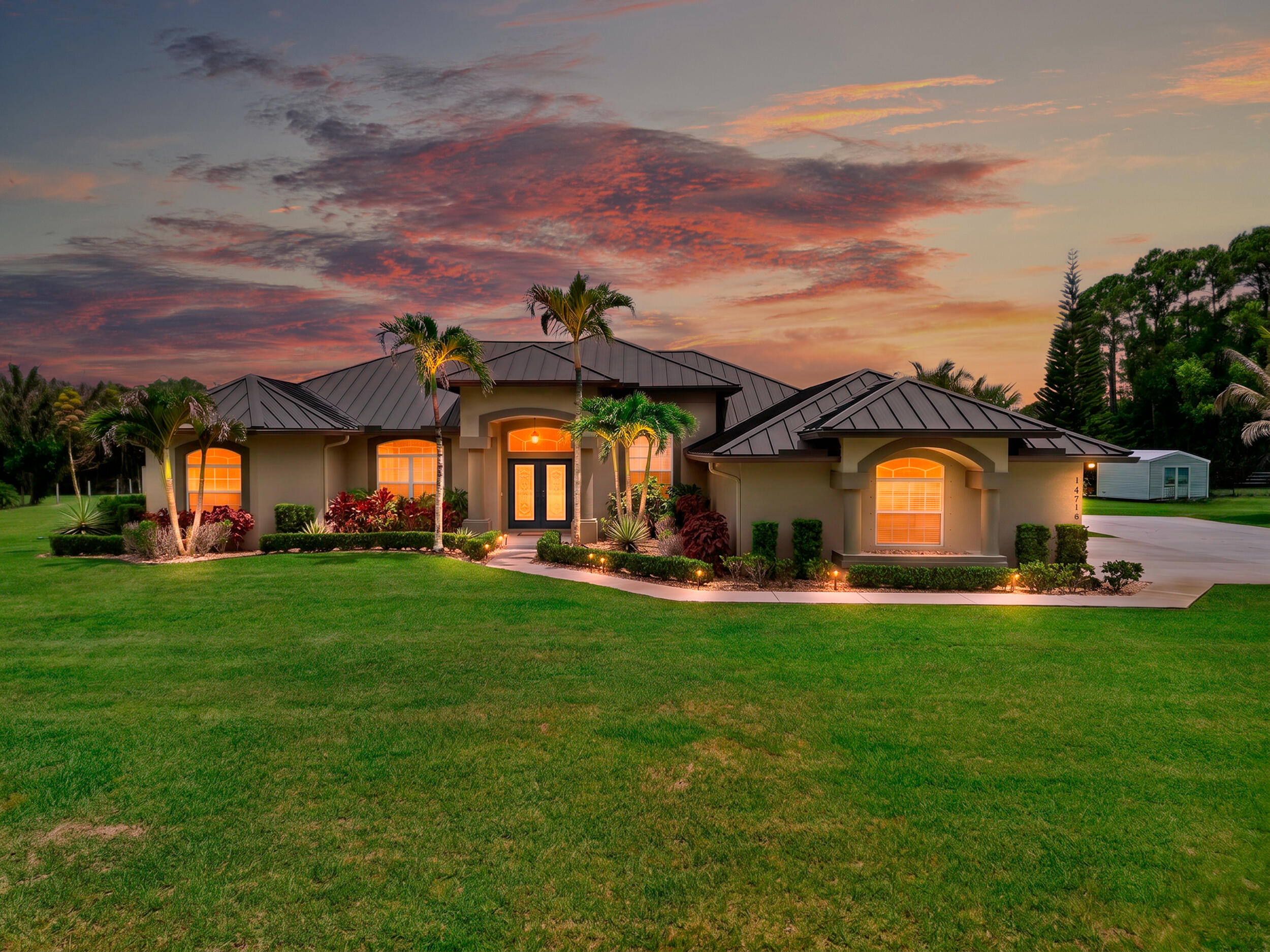 Welcome to this single-story residence in Loxahatchee, offering 2,697 square feet of finished living space designed for comfortable modern living. This four-bedroom, three-bathroom home provides ample room for various living arrangements and entertaining needs. The three-car garage accommodates multiple vehicles and additional storage, while the open floor plan maximizes the usable interior space. Situated on acreage in the ACREAGE community, this property presents a wonderful opportunity for those seeking space and room to grow. Discover the potential this well-proportioned residence holds for your next chapter.