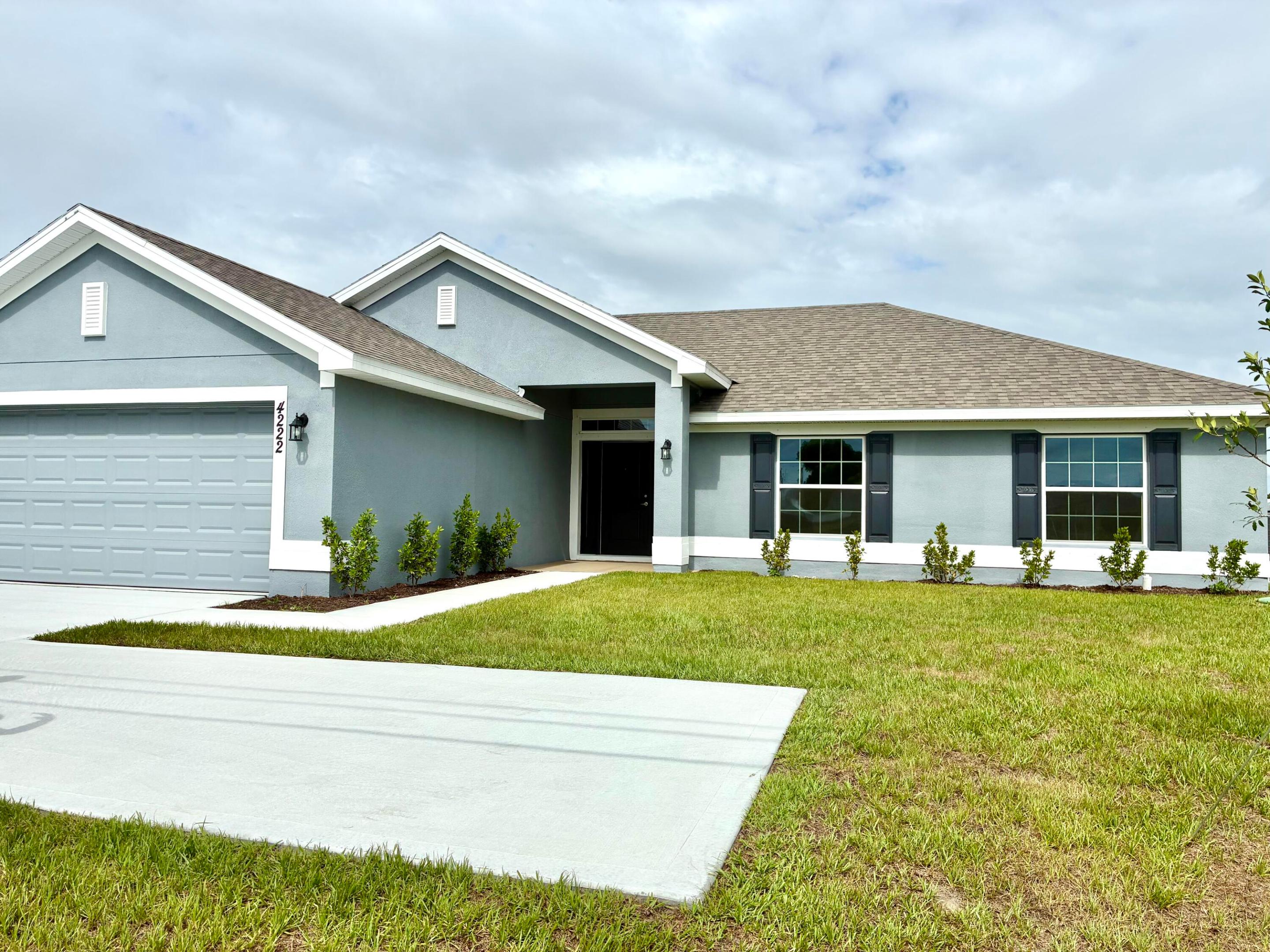 MOVE-IN READY Secure a 4.99% 30-Year Fixed Rate with approved lender plus $10K FLEX CASH! ONLY $1,000 DEPOSIT. Save thousands in closing costs when using seller's preferred lender. This beautifully crafted new construction home (sample photos) offers 4 bedrooms, 2 baths, a spacious walk-in shower, vaulted ceilings, and a 2-car garage, with tile throughout main living areas. Ideally located with quick access to shopping, dining, beaches & Tradition Square. Builder warranty included—an exceptional value and opportunity you don't want to miss!