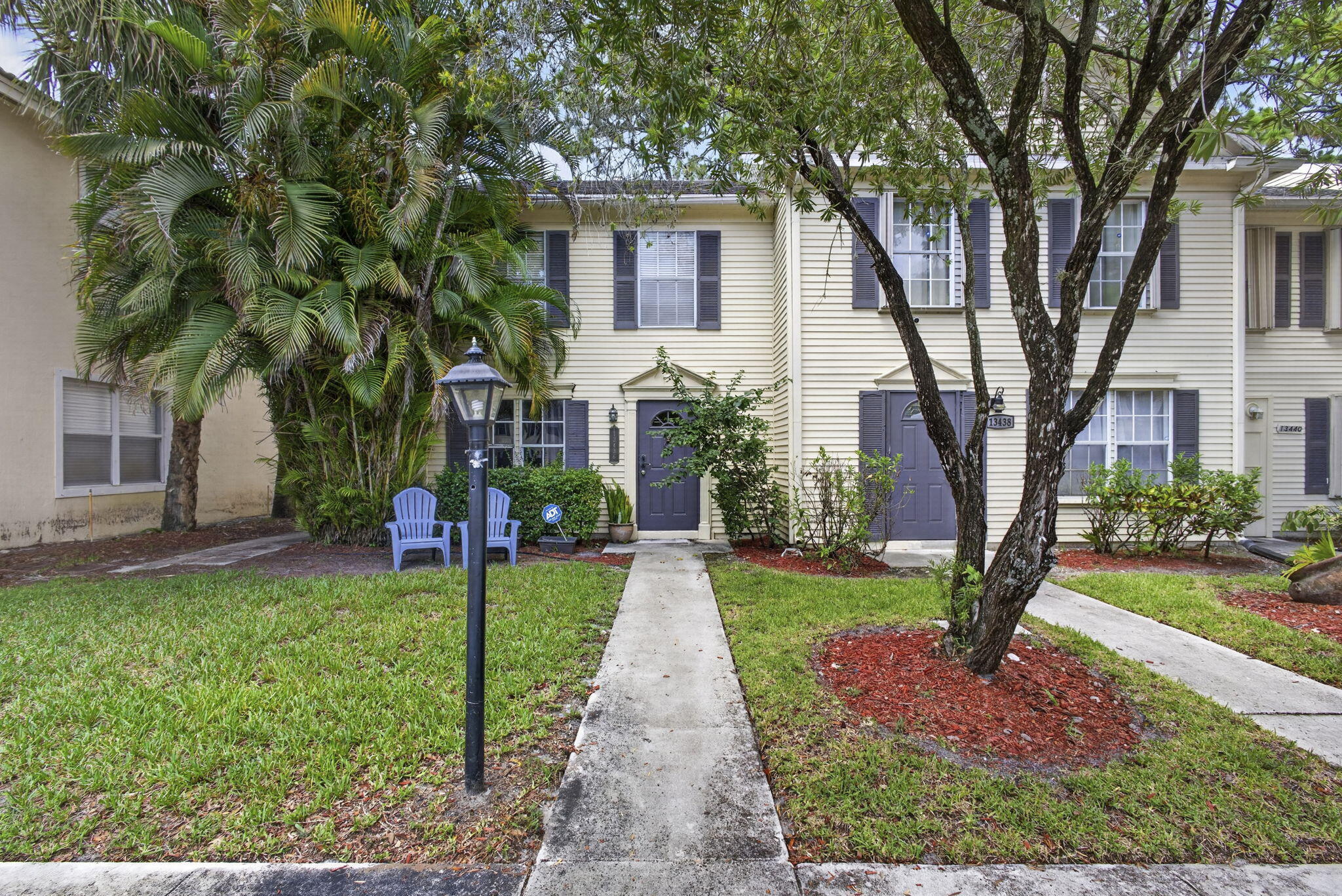 Located in the heart of Wellington, this 2-bedroom, 2.5-bath townhouse offers an incredible opportunity for homeowners and investors alike. Just a short walk to top-rated schools, shopping, dining, and everyday conveniences, the location simply can't be beat. With strong rental demand in the area, this property presents excellent income potential for both annual and seasonal rentals.  Priced aggressively, this home provides the perfect canvas for a new owner to create their dream space. Add your own personal touches, updates, and renovations while building instant equity. The spacious floor plan features two generously sized bedrooms, each with its own private bath, plus a convenient half-bath for guests. Whether you're looking for a primary residence, seasonal retreat, or investment property this townhouse offers exceptional value and unlimited potential in one of Wellington's most sought-after locations.