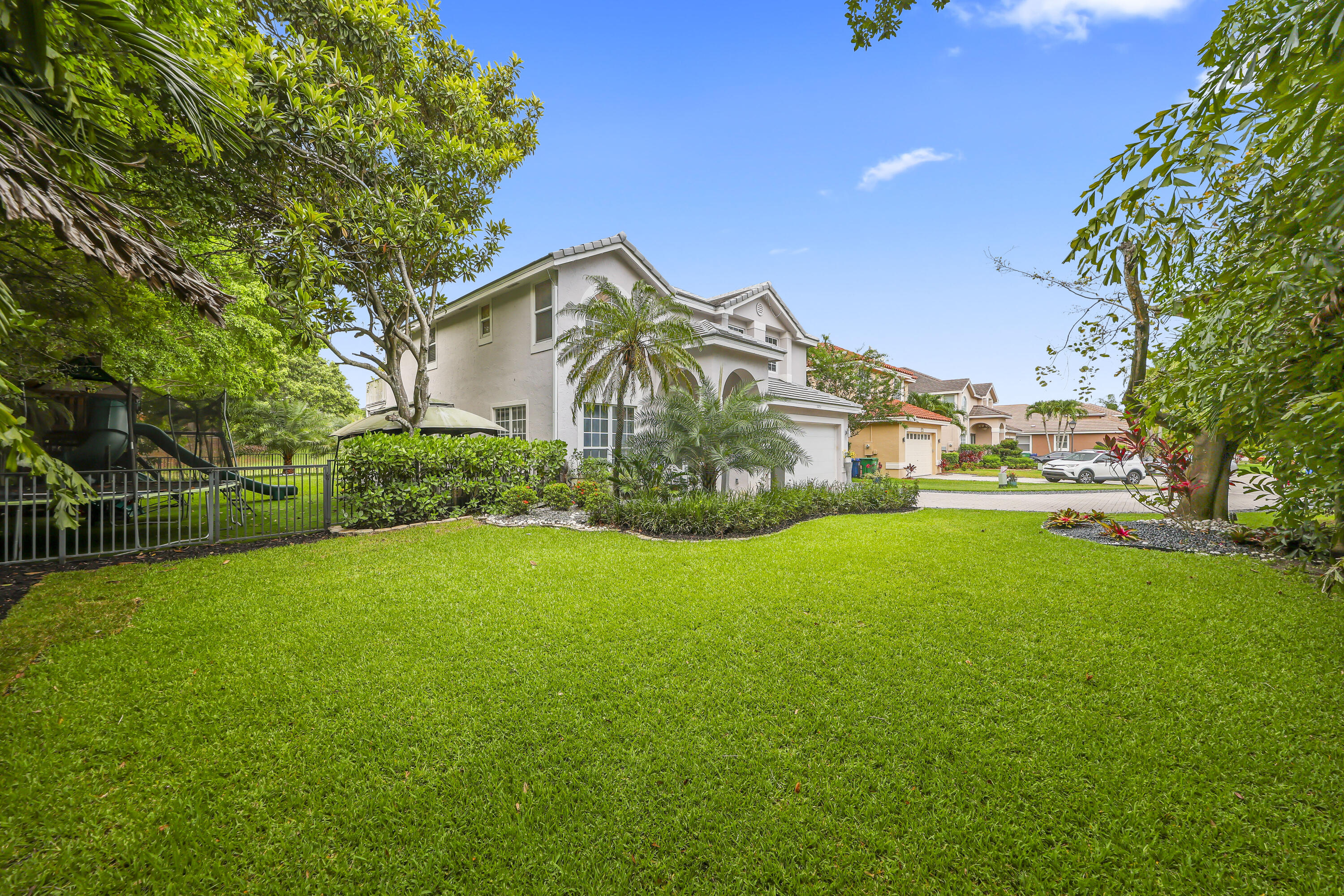 Golf Course and Water Views. Cul de Sac , Water and Golf Course Views  New Roof 2025. Hurricane impact doors, windows and garage door. Top to bottom full designer luxury, remodeled 2018 - 2025.  Dream marble Spa bath retreat with jetted tub and dual shower towers.  Designer custom kitchen with GE Cafe appliances and quartzite stone countertops and illuminated enormous quartzite island. Herringbone floors. True open floor plan. Wall removed to open up kitchen. Kitchen open to living, dinning , breakfast nook, and family room. 5 bedrooms upstairs.  Added insulation and massive shade trees keep the electric bill 1/4 cost of other residences! Two floors of laundry.  Perfect for families and entertainers!  This is a large home on one of the largest lots in Eagle Trace Hamptons.  Enjoy  nature,  the water, and Eagle Trace golf course views. NO membership required.  Cul de sac , partially wooded lot. Incredibly long 8 car driveway for you and your guests. LIFE Changing upstairs all in one computerized AI washer and dryer AND separate full size units downstairs.  Two floors of laundry! Every inch of the home has been upgraded. Playground and park in your very own yard!  Custom home with true open floor plan kitchen open to living room dinning breakfast nook and family room.