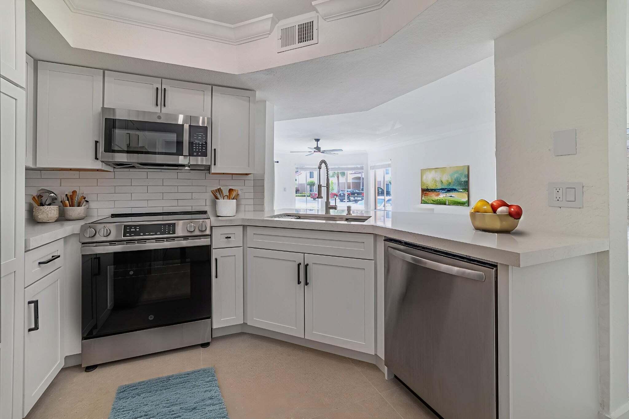 Enjoy living in this beautifully Renovated 2-bedroom, 2-bathroom corner unit located on the first floor in the highly desirable community of Casablanca Isles. This spacious and bright apartment offers stunning views of the tennis courts and garden. The modern kitchen has been fully updated with Quartz countertops, a stylish backsplash, brand-new cabinetry, and stainless steel appliances. The home also features new tile flooring throughout, crown molding, upgraded baseboards, and freshly painted, Each of the two bedrooms includes a walk-in closet with built-in shelving and a fully updated private bathroom. Step outside to the tiled patio. In-unit washer and dryer, a 2021 A/C, and 2020 water heater. Water included in the monthly rent.  Condo is within walking distance to the clubhouse. Casablanca Community is ideally located near fine dining, shopping, major highways, stunning beaches, and vibrant neighboring towns just a short drive away.