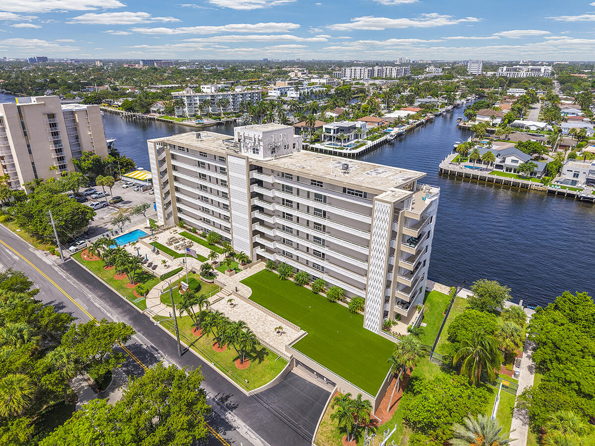 Motivated seller! Extremely rare corner double-unit penthouse on the Intracoastal. Features 850 sq ft south-facing open terrace and hurricane-impact windows framing ocean and Fort Lauderdale skyline views. Recently renovated with marble-vein porcelain flooring throughout.  Custom kitchen offers quartz countertops, pull-out cabinetry, and Bosch black stainless appliances including double oven and French door refrigerator. Two full bathrooms showcase mosaic tile walls and floating wood vanities. Separate 200 sq ft maid's quarters includes full bath and refrigerator. Underground double parking spaces included right next to elevator. Spectacular waterfront living—must see to appreciate this truly unique residence.
