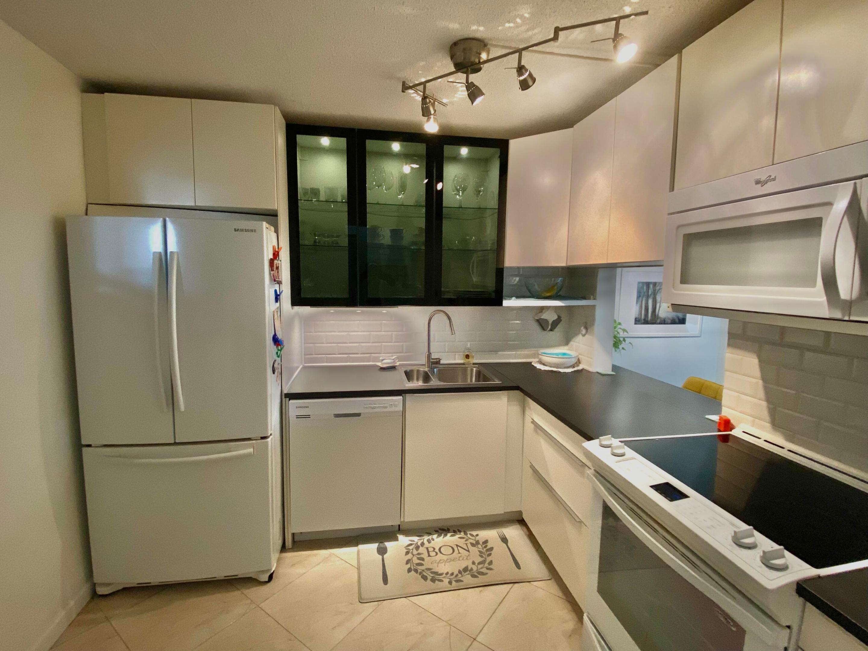 Beautiful updated, spacious waterfront condo in 55 plus active community!  Just minutes to the Atlantic Ocean and Palm Beach!  Leave those cold winterry days behind and own your own PARADISE in South Florida, Palm Beach County!  Newer modern kitchen, with soft close cabinets. Newer appliances. Updated, modern bathroom. Newer neutral flooring and walls throughout. (furniture included)  Convenient to all major retail and shopping as well as major interstate, I95  West Palm Beach downtown and beaches are just 20 minutes away!  Hurry, don't miss out on this incredible opportunity to relax in S Florida sunshine!  Bring your offer today!