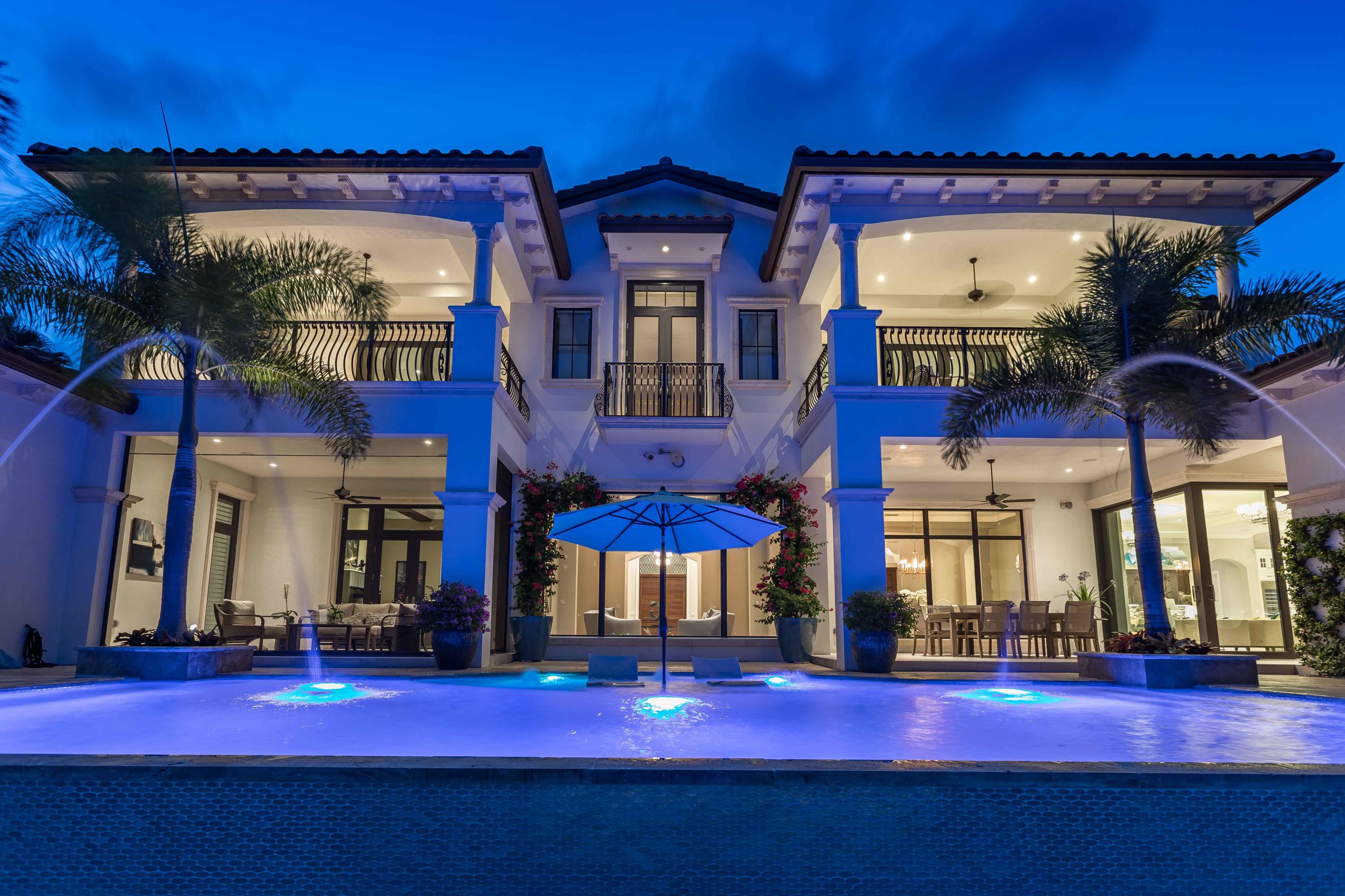 Incredible Intracoastal estate on over-sized lot 177' of deep water frontage.  Resort style living with pool, outdoor kitchen and bar, gym, indoor/outdoor fireplaces, home theater, 33K and 12K elevator boat lifts.  The custom interior features 14' ceilings, gourmet chef's kitchen, 1st and 2nd floor laundry, 4 separate guest suites in addition to a luxury master BR suite and sitting area.  Equipped with smart home electronics, impact glass windows and doors, LED lighting, 80K generator, 1000 gallon propane tank, and 4 car garage.  This home has it all!