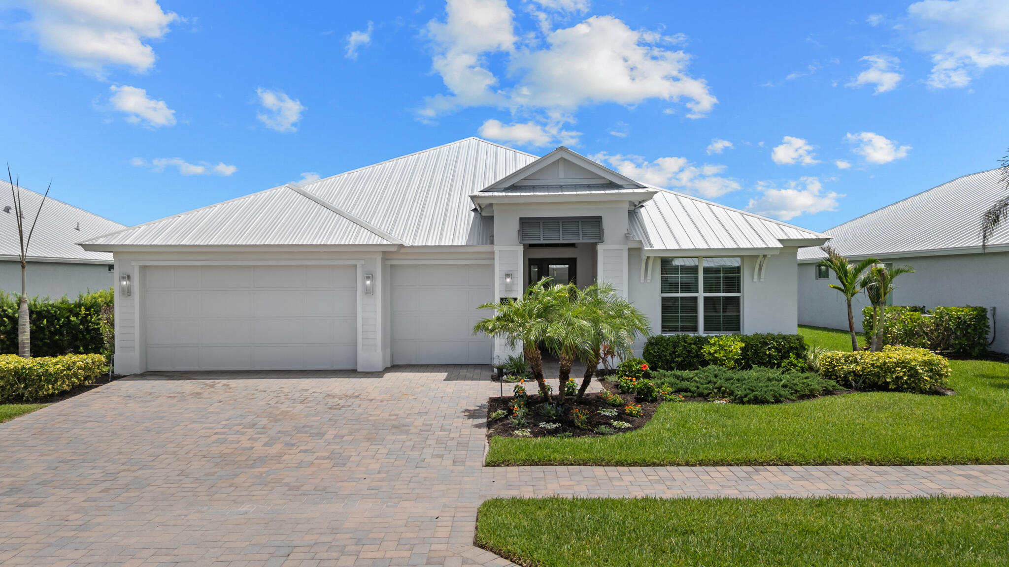 Elegant lakefront living in gated Arabella Reserve. This beautifully designed 3-bedroom, 3-bath residence features a desirable triple-split floor plan plus a private den with double-door entry that easily converts to a 4th bedroom. The gourmet kitchen is appointed with quartz countertops, an oversized island with seating, double ovens, stainless appliances, and a spacious pantry. Light-filled open-concept living areas showcase serene south-facing lake views, while neutral tile and wide-plank wood-look flooring create timeless appeal. Situated on a deep, pool-ready homesite, this exceptional home also offers impact glass, a metal roof, paver driveway, and a three-car garage. Conveniently located near shopping, dining, golf, beaches, and everything Vero Beach has to offer.