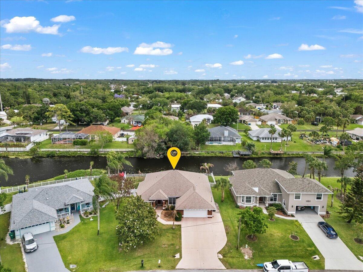 Experience the perfect blend of waterfront tranquility and modern efficiency.  A meticulously maintained CBS-constructed home built in 2002 on a quiet Sebastian canal. This residence features a private dock and kayak launch within a fully vinyl-fenced backyard, ideal for peaceful afternoons on the water. The interior shines with luxury vinyl plank and tile flooring throughout, complemented by elegant wainscoting and a gourmet kitchen with maple cabinets and stainless steel appliances.  New roof (2022), A/C (2021), and fresh interior and exterior paint (2025). Most notably, the newly installed solar system provides incredible energy efficiency with utility bills as low as $25 per month, and the seller will pay off the solar panels in full at closing.  NEW quartz countertops 2026.