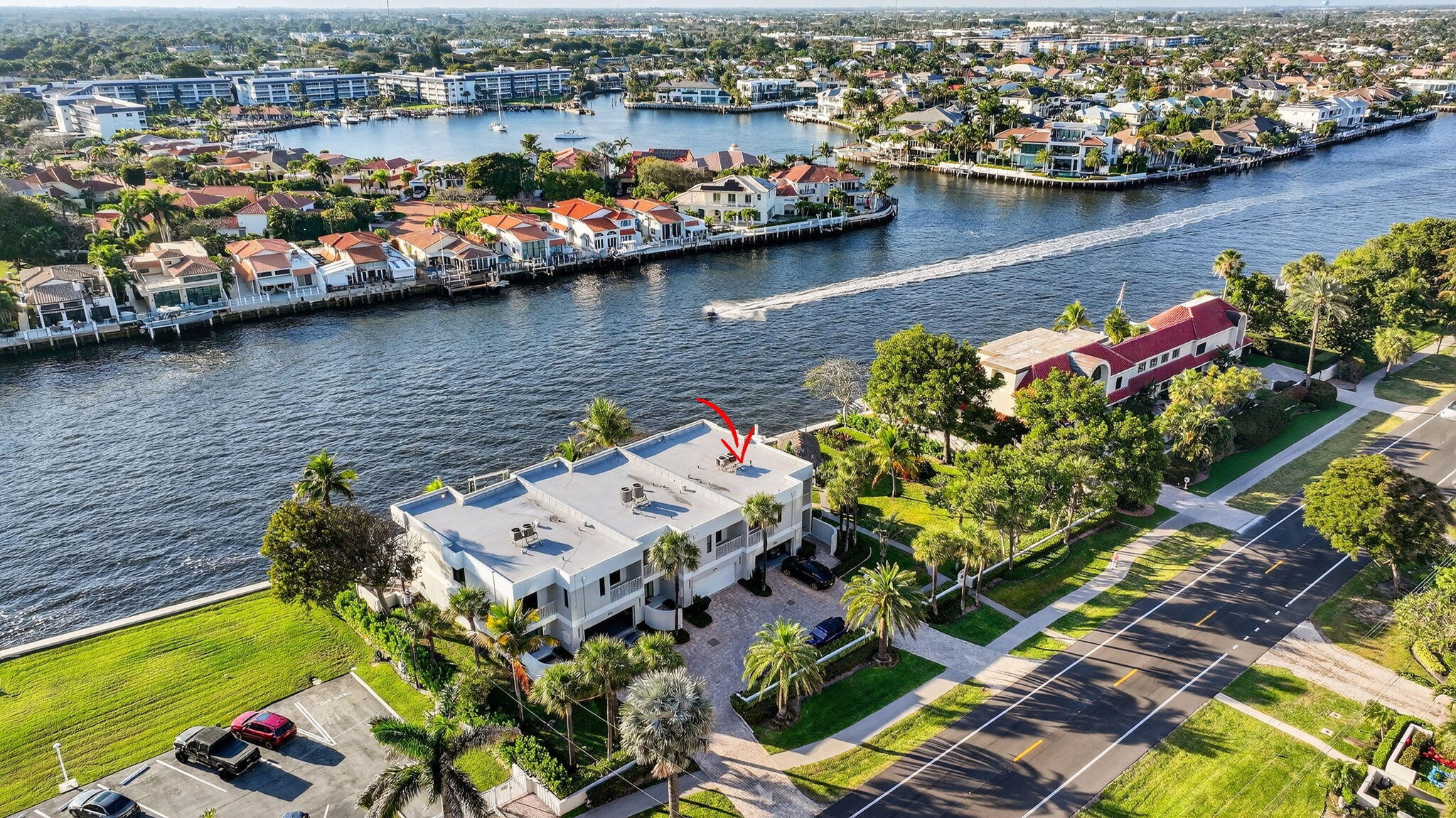 Enjoy a unique Townhouse that's relaxed, elegant, modern and sophisticated with breathtaking views!  Watch the boats go by from every room!  The oversized patio is perfect for outdoor living and entertaining & has it's own jet ski lift!  Also perfect for boaters!  A tropical paradise, located next to a tranquil park with a Tiki Hut!  Featuring an open kitchen, purified  water system, onyx island, wet bar, sage lacquer cabinets and white mother-of-pearl wall covering!  Enter the upstairs main bedroom through french doors, walk-in closet, custom wardrobes, steam shower w body jets, a loft/office with intracoastal views! Trafalgar Condo has beach access, gym, saunas, pool and hot tub on the ocean side.  Please allow 24hrs notice to show.  Must be seen and will not last!