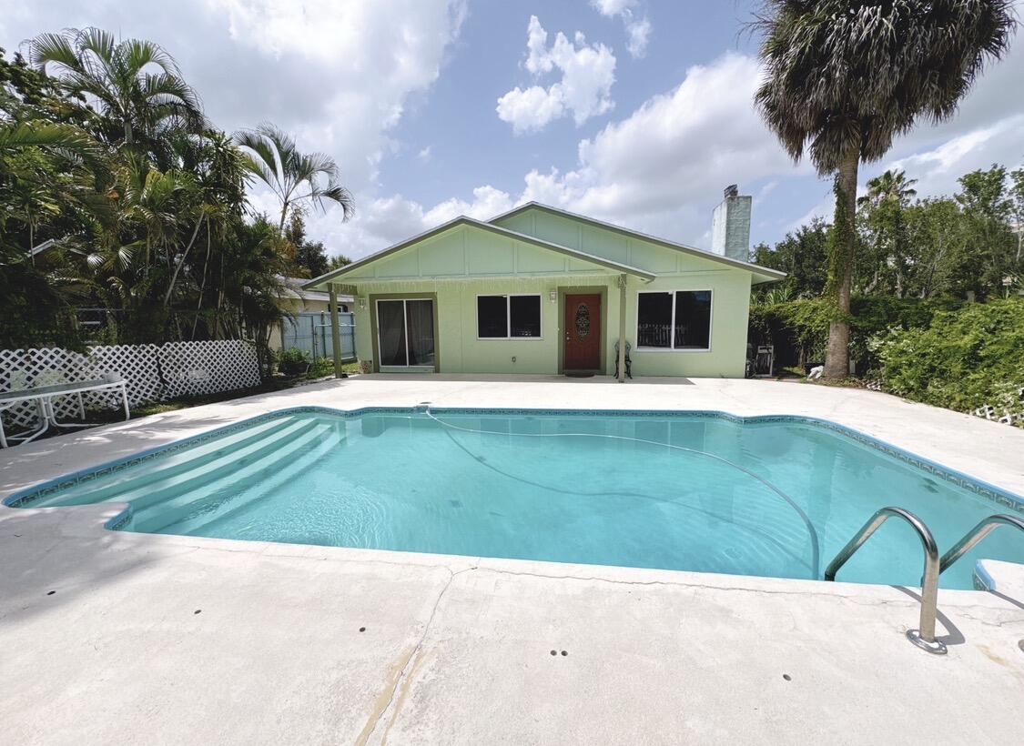 This property without HOA, located near shopping, dining, beaches, the Turnpike, and I-95, it's offer large, fenced backyard, pool, work shed, and plenty of space for RVs, boats, or trucks. This is a unique opportunity to own a family compound or primary home with an income property. Offer the unique experience of country living right inside the city. Don't miss this once-in-a-lifetime opportunity!!