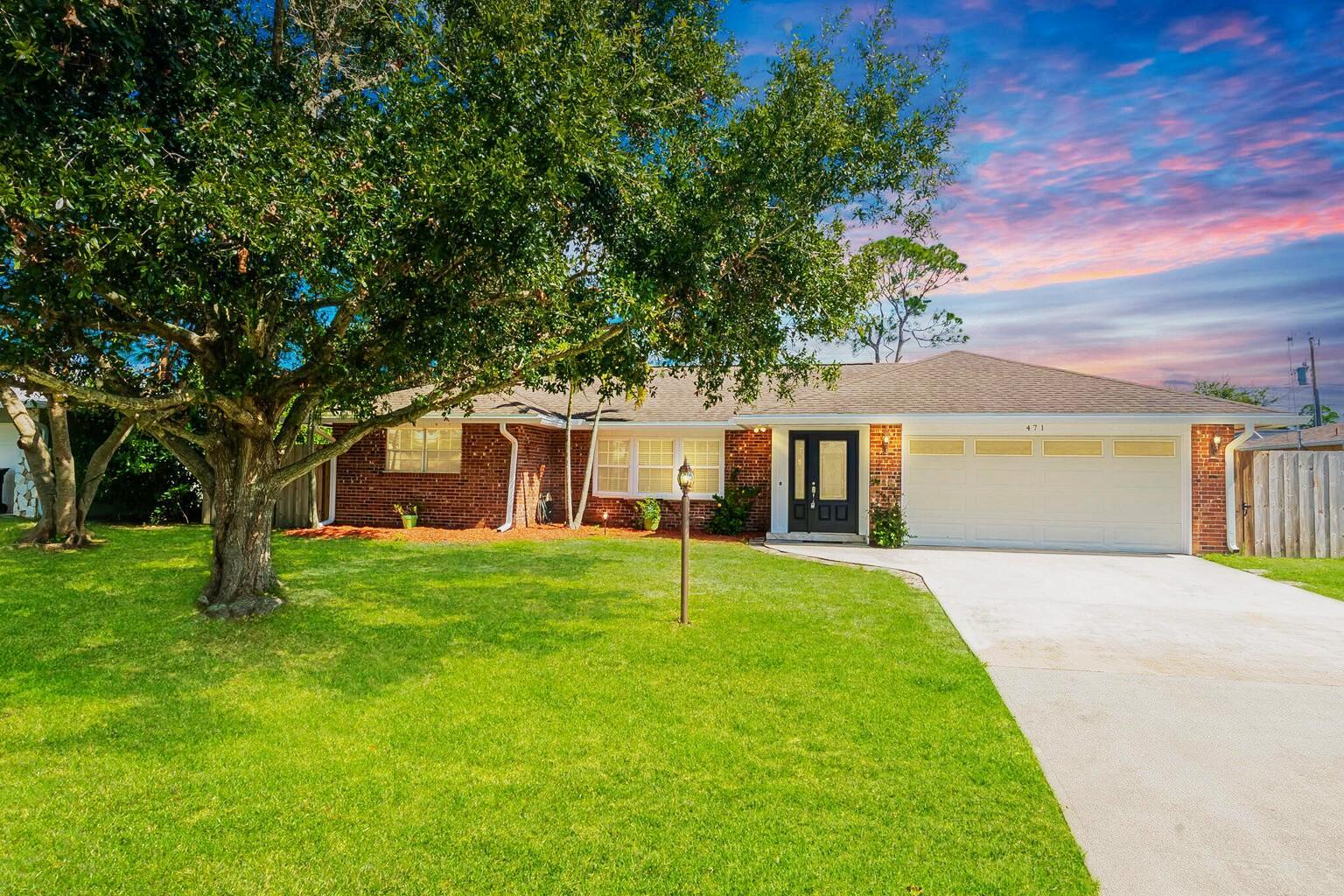 Well-Maintained 3/2/2 home - new shingle roof to be installed!  Updated with modern finishes throughout. Spacious brick home featuring separate living, dining, and family room areas. Tiled floors throughout. The kitchen offers stainless steel appliances, a pot filler, ample wood cabinet spaces, new quartz counters. The primary suite includes dual sinks and a walk-in shower. Additional features include French and pocket doors, pull-down attic access, and partial hurricane shutters. Enjoy outdoor living on the open patio overlooking the large fenced backyard. Major updates include a 2018 A/C and water heater. A great deal, check it out!