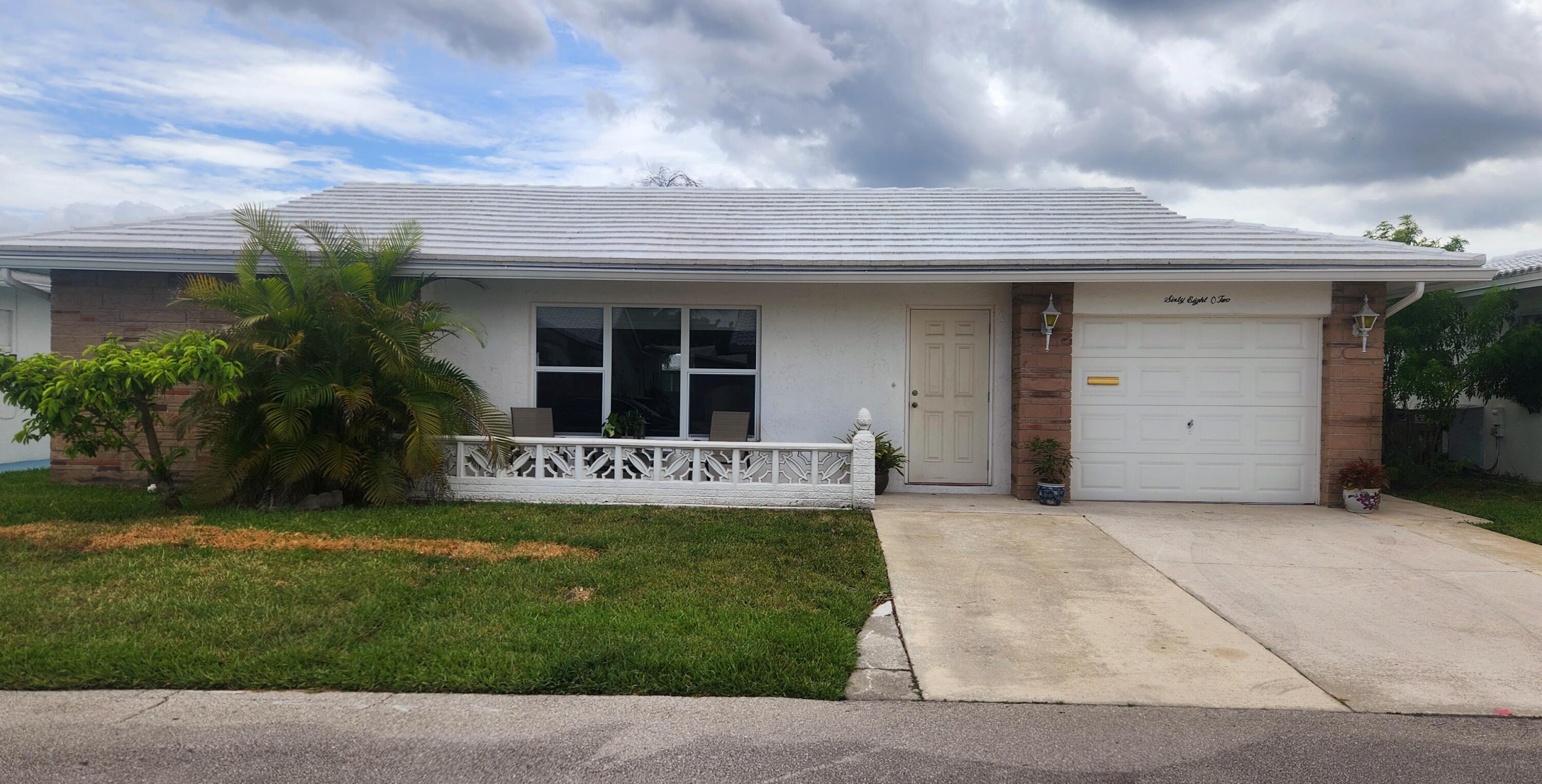 This stunning spacious home was enlarged and remodeled with permits. Now approximately 1800sqft LA and a true 3 bedroom, 3 bath, and a tri split floor plan. The home is in a quiet 55+ adult community on a wide canal. All IMPACT windows and doors, brand new A/C, flat roof replaced in 2025, and wood laminate flooring throughout the home. Completely renovated kitchen features new cabinets, granite countertops, SS appliances, and an island with electric. All bathrooms remodeled with showers. There's a living room, family room, and 1 car garage with a 2-car concrete driveway. The 3rd bedroom could be used as a bedroom or office with a walk-in closet and bathroom. Low HOA fees include lawn maintenance, house painting, clubhouse, pool, and more. Beautiful spacious home you must see!