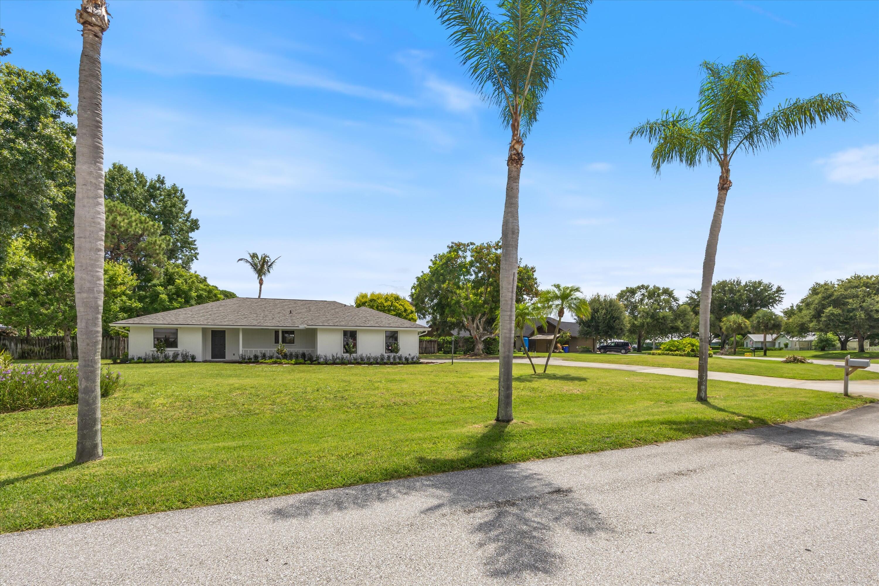 Turnkey Coastal Oasis in Jensen Beach - Move-In Ready Pool Home! Beautifully renovated 3-bedroom, 2-bathroom single-family home perfectly situated in a desirable Jensen Beach neighborhood on a generous half-acre lot, this property offers the ideal balance of modern comfort, outdoor enjoyment, and a superb location. Step into an inviting open-concept layout where the chef-inspired kitchen steals the show: white shaker cabinetry, elegant countertops, a large center island with bar seating, stainless steel appliances, and stylish pendant lighting. It flows seamlessly into the bright living and dining areas, all featuring beautiful light wood-look flooring and neutral finishes that create a fresh, contemporary feel. The spacious primary suite provides a private retreat with an attached office over looking the pool area, complemented by two additional generously sized bedrooms. Both bathrooms have been tastefully updated with modern wood vanities and sleek fixtures. A 2-car garage adds convenient storage and parking.  Outside is pure Florida magic. Relax year-round in your private screened-in pool area with ample patio space for entertaining, surrounded by lush landscaping and mature palms. The expansive 0.51-acre lot offers plenty of room for play, gardening, or future outdoor expansions, and lots of room for parking.  Recent major updates include a brand-new 2026 roof and a brand-new 2026 A/C system with all new ductwork — giving you peace of mind and lower utility costs right from day one. Prime Jensen Beach location — just minutes from Jensen Beach Park and the pristine sands of Jensen Sea Turtle Beach (famous for its nesting sea turtles). Enjoy easy access to the Indian River Lagoon for boating, fishing, kayaking, and paddle-boarding. Stroll or bike to charming downtown Jensen Beach for boutique shops, art galleries, waterfront restaurants, and fresh seafood. Top-rated Martin County schools (A-rated district, including highly regarded Jensen Beach Elementary) make this perfect for families. Low HOA fees, convenient access to US 1 and I-95, and proximity to Stuart, Treasure Coast Square, and Palm Beach County add even more appeal. Whether you're looking for a forever family home, or a turnkey investment property this gem checks every box. Don't miss this rare opportunity in one of the Treasure Coast's most loved communities. Schedule your private showing today!