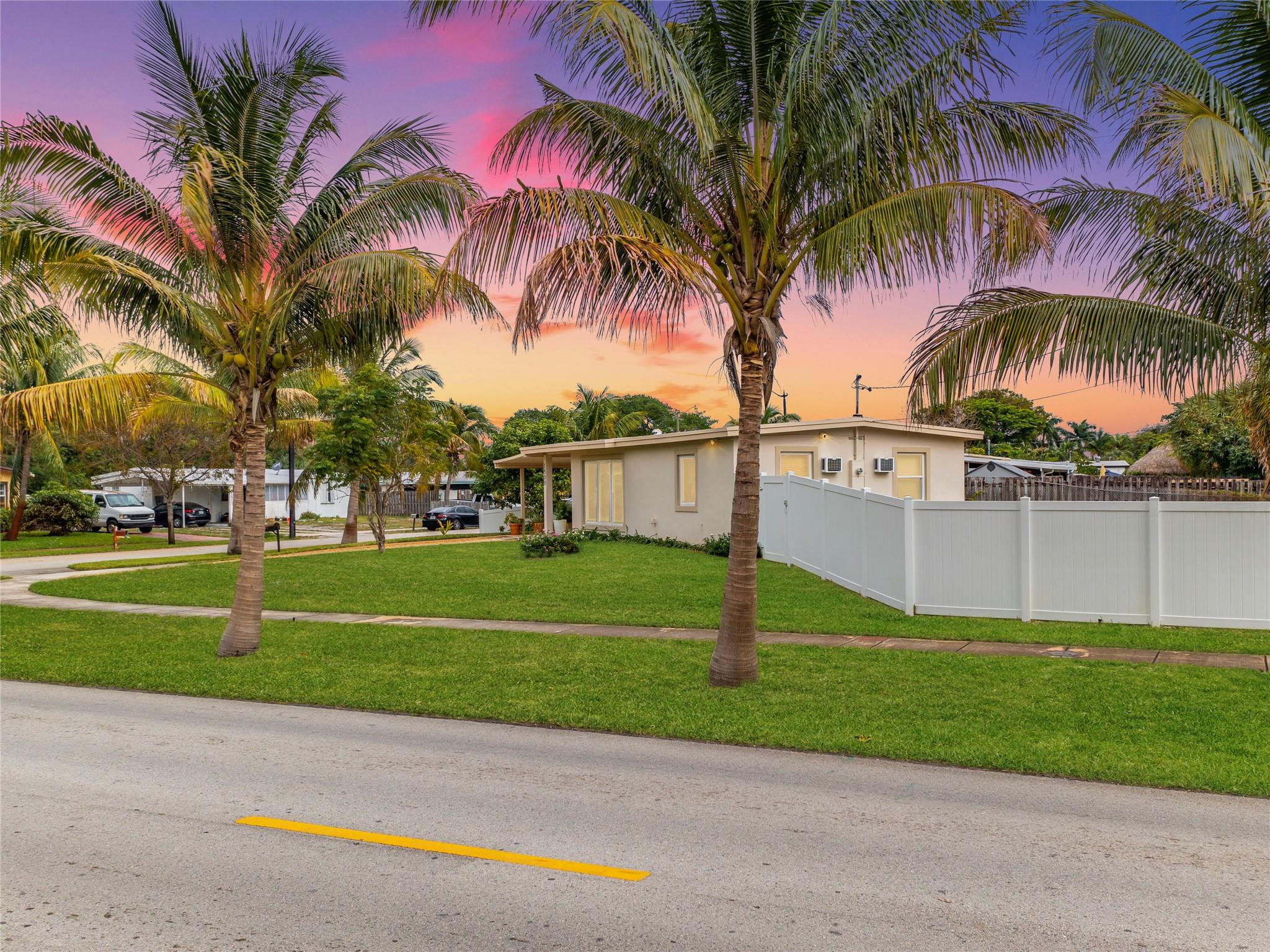 A COMPLETELY RENOVATED POMPANO BEACH HIGHLANDS FLORIDA HOME WITH NO HOA FEES!  2– BEDROOM WITH 1-BATH, ON AN OVER-SIZED PARCEL WITH A HUGE FENCED IN BACKYARD ON CORNER LOT. THE KITCHEN HAS GAS STAINLESS STEEL APPLIANCES. NEWER HURRICANE IMPACT WINDOWS & DOORS & A NEW ROOF WAS  JUST INSTALLED 2023, NEWER WASHER & DRYER, NEWER RENOVATED BATHROOM OTHER UPGRADES INCLUDE GAS STAND-BY GENERATOR SYSTEM & VIDEO SECURTIY SYSTEM, & NEWER ELECTRICAL PANEL. THIS BEAUTIFULLY HOME FEATURES, A LARGE MASTER BEDROOM WITH EXTRA LARGE CLOSET AND A FLORIDA ROOM OFF THE KITCHEN, COVERED PATIO  IN FRONT NEXT TO THE CARPORT, FRESH LANDSCAPING INCLUDING A MATURE COCONUT TREE AND A OVER-SIZED CONCRETE ROCK DRIVEWAY WITH AN EXTRA STORAGE CLOSET IN BACK. THIS HOME IS CLOSE TO THE BEACH, RESTAURANTS & ENTERTAINMENT!! A rare find, an outstanding value, in one of Pompano Beach Florida’s finest communities. A Beauty in highly desirable Pompano Beach Highlands with probably the best kept, best maintained, and best looking home in the subdivision. Located on one of the best parts of the neighborhood.  This is your chance to purchase a very dramatic remodeled home with two full- bedrooms and one- full bathroom, a one- story home with an oversized four car concrete and rock driveway.  The property has been completely up-graded on the interior and the exterior.  A designer’s masterpiece, with nothing that has been left undone in this one of a kind home.  Thousands of dollars spent in beautiful lush landscaping to include massive mature coconut tree in the front yard, enclosed covered patio in the front of the home off the carport.  A Formal living room / great Florida room / family room with formal dining room.  An open floor plan, with tile floors.  A gourmet designed Kitchen with gas stainless steel appliances, top of the line fixtures and appliances, custom wood cabinets, and a pantry. Master bedroom has a sitting area, super-sized closet.   Bath is a remodel with newer fixtures and sink.  Floor plan is a stacked plan with the master on side of the home and the other bedroom on the other side. Laundry room is off the patio with newer washer and dryer with an extra closet storage outside. Other extras include custom interior designer interior paint, updated electrical panel, impact Hurricane windows & doors, Rain Soft whole home water purification system, new roof installed Dec. 2023, gas stand-by generator system, video security system, and a top of the line washer & dryer package. All of this in an extremely well maintained community, within close walking distance to parks and schools and the beach. This private bed and bath community is conveniently located near shopping, dining, and entertainment. The intimate and friendly neighborhood is also just minutes from I-95 and Turnpike. Nestled on a quiet street, this property has a spacious front and oversized fenced-in back yard with room for a pool on a corner lot.  The owner’s attention to detail has made this unit, “ready to go”, move in condition. With the best of everything, move-in to this exceptionally maintained home in the Heart of the Pompano Beach Florida. If you are looking for a very private yet spacious home in one of South Florida’s most sought after communities, look no further and make an offer, No HOA!   No HOA fees!   The very best of everything, Not a Short Sale, Not a foreclosure, A Quick and easy move in!