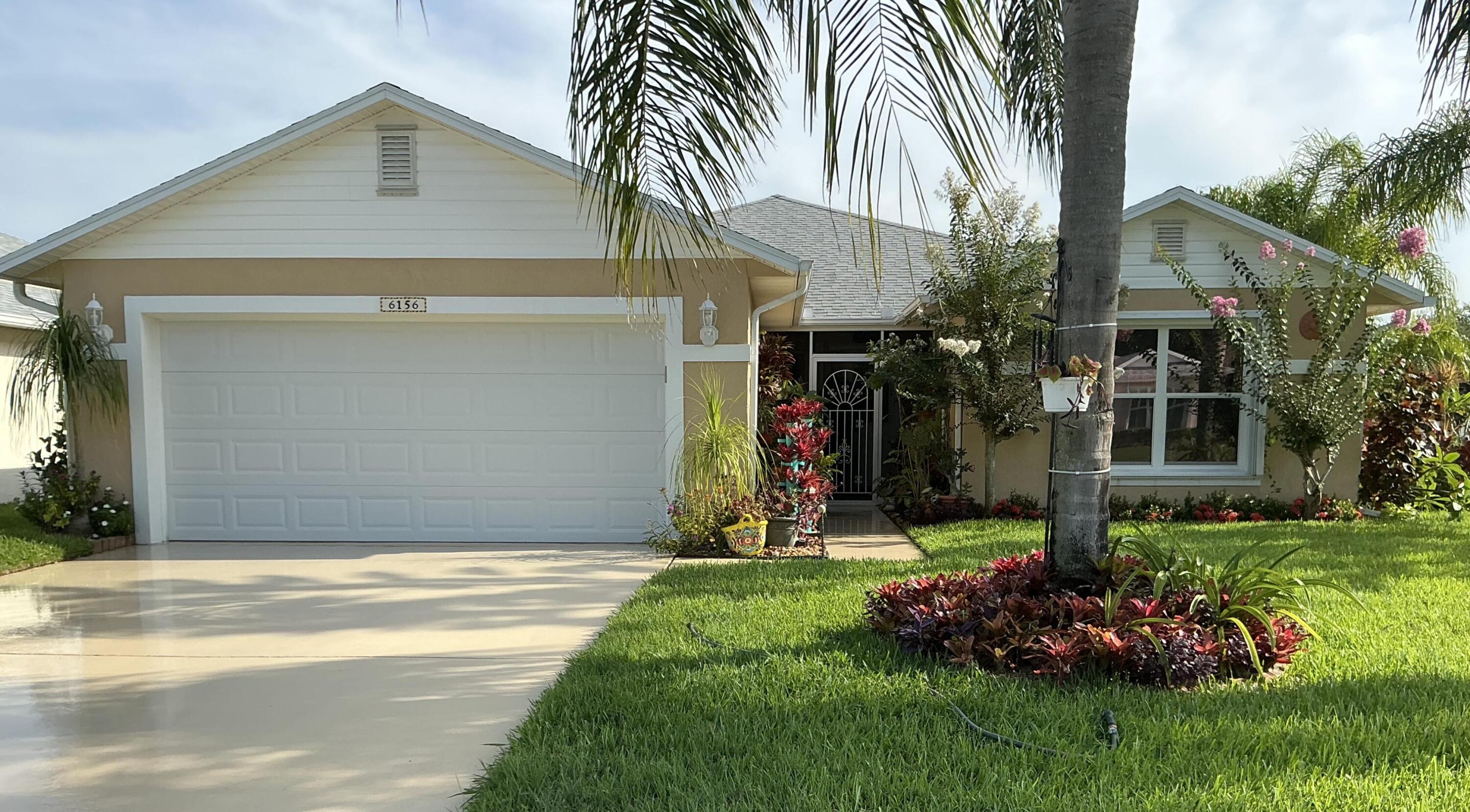 This unique Home in the Palm Grove  community stand out with amazing landscaping and great curb appeal.  This home  has been totally remodel,  including 2025  new air, 2018 roof,  new hot water heater, and washer and drier.  The stove and micro also have been replaced.  The bathrooms have both been remodel with porcelain tile and safety bar.  The lanai has been remodeled with AC and insulation,  allowing this area to flow into the main rooms.  Total porcelain tile on floors.  Windows are treated with dark film, plus black out curtains.  All window have window treatments.  Plus so much more.
