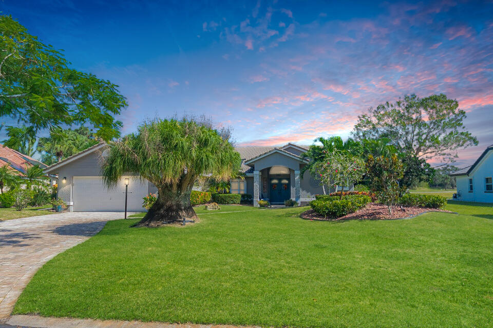 Indulge in Luxury Living in Country Club Estates! This stunning 3/3/2 golf front, pool home offers the epitome of refined living. Nestled in a beautiful cul-de-sac, this gorgeous updated home features a spacious layout with 2549 sqft under air, boasts wood burning fireplace, wine bar, elegant crown molding, chair rail and tile flooring throughout the main areas. The media room/office/family room features french doors. 2 zone a/c, water heater 2016. Accordion hurricane shutters. The expansive outdoor oasis features a massive saltwater, solar heated pool, screened-in for year-round enjoyment with a full cabana bath and covered lanai perfect for relaxation. Situated on the coveted 4th green of the St Lucie Trails golf course, right in the heart of St Lucie West.