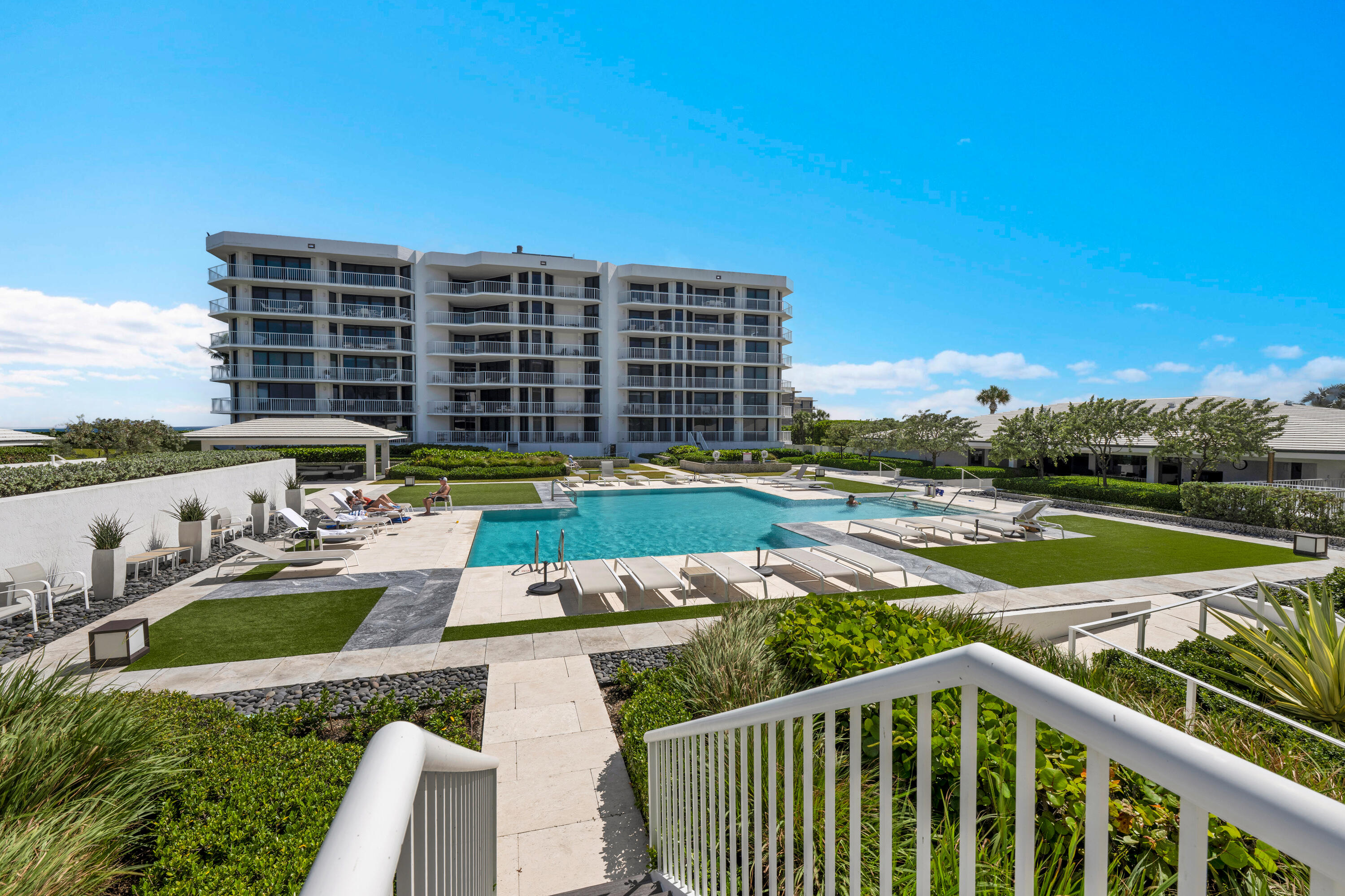 This spacious 2 Bedroom en-suite is an exceptional blend of luxury, comfort and resort style living.  This unit lives like a beach house with your own private staircase to the beautifully landscaped infinity pool and spa by award winning Mario Nievera.  This full service building offers amenities second to none including a state of the art fitness center, social/party room, har-tru tennis courts, concierge services and of course 24/7 security.  The Enclave has undergone extensive upgrades with newly redesigned lobbies and hallways, and complete concrete restoration.  All assessments have been paid.   This light filled residence has a southern exposure with magnificent ocean views.  The impact windows lead out to a huge covered balcony, creating an effortless indoor outdoor living area.    Enclave is Pet Friendly, centrally located near restaurants, shopping, golf and markets.  Additionally, there is a fully furnished 2 bedroom guest suite for owners guests.  There is a full time manager on premise. Whether you choose to enjoy this magnificent spacious unit "as is", or you customize it to your exact likings, this oceanfront retreat welcomes you to come enjoy the Palm Beach lifestyle.