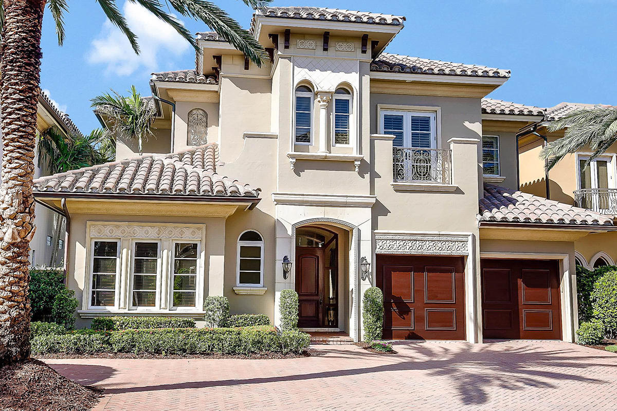 This waterfront estate is located in Ocean Cove, a gated enclave of 22 estates in Highland Beach on 10.5 acres of nature preserve with a private marina. The 5 bed/5 bath home, with 6191 square feet of total living space, is offered turnkey furnished optional. The master and bath have water views, a balcony, and a walk-in closet. The custom kitchen has two islands and a breakfast bar, and the family room and living room both have fireplaces. In addition, there is a formal dining room, a full gym, an elevator and a generator. Exterior features include a waterfront heated pool and spa, patio with loggia, kitchen, ocean access, deeded deepwater boat slip, private dock with electric/water/lift and attached two-car garage. Many rooms expose spectacular views of the wide Intracoastal Waterway