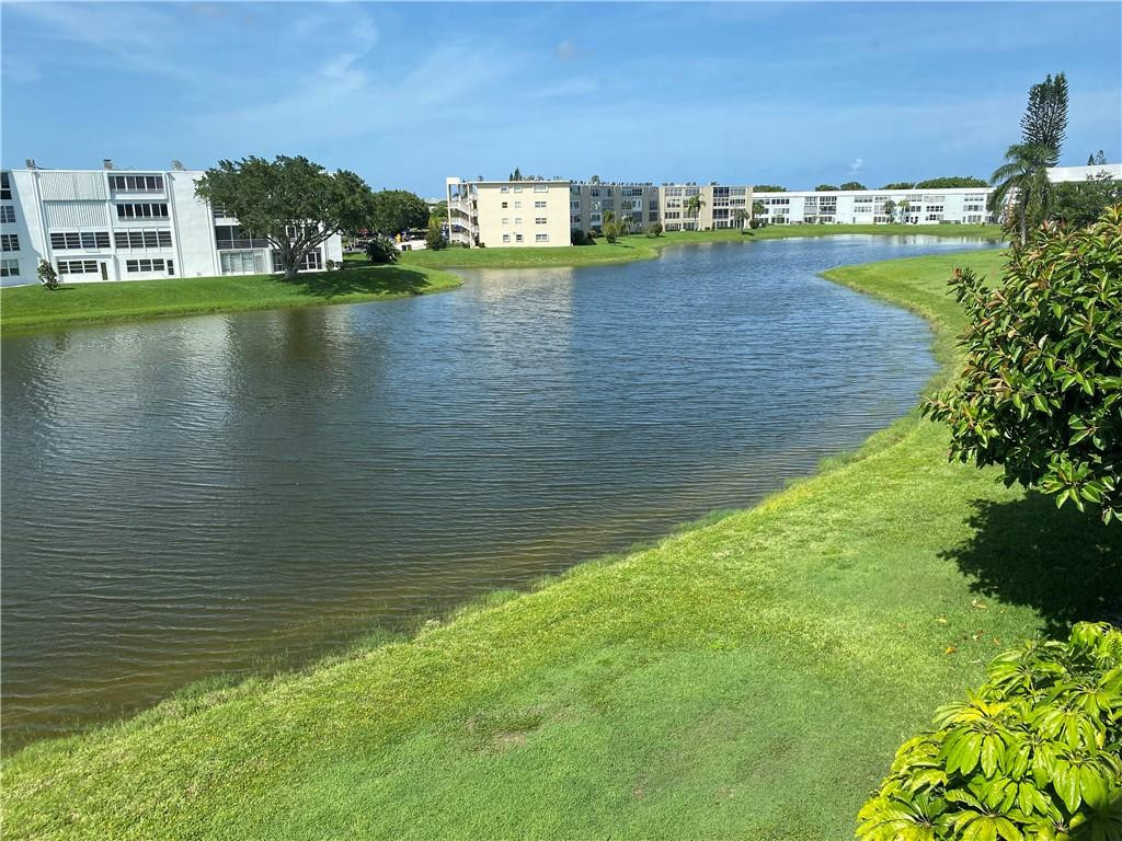 Stunning 2/2 Lakefront, poolside corner unit on cul-de-dac. 55+ well maintained building with elevator. New impact windows and doors, granite counter tops with stainless steel appliances. Ceramic tile throughout, wood cabinets and vanities.  Fully furnished and move in ready. Both Bedrooms have access to a long, closed porch with lots of natural light and stunning lake views. Walk in closet in the Master Bedroom. AC from 2018. Furniture included.  Some personal items will not convey. Maintenance includes Indoor Mineral Pool, Outdoor Pool, Sauna, a beautiful Theatre with great performances, Bocce, Library, Billiard Room, Fitness Center, Shuffleboard, Tennis and a Courtesy Bus.