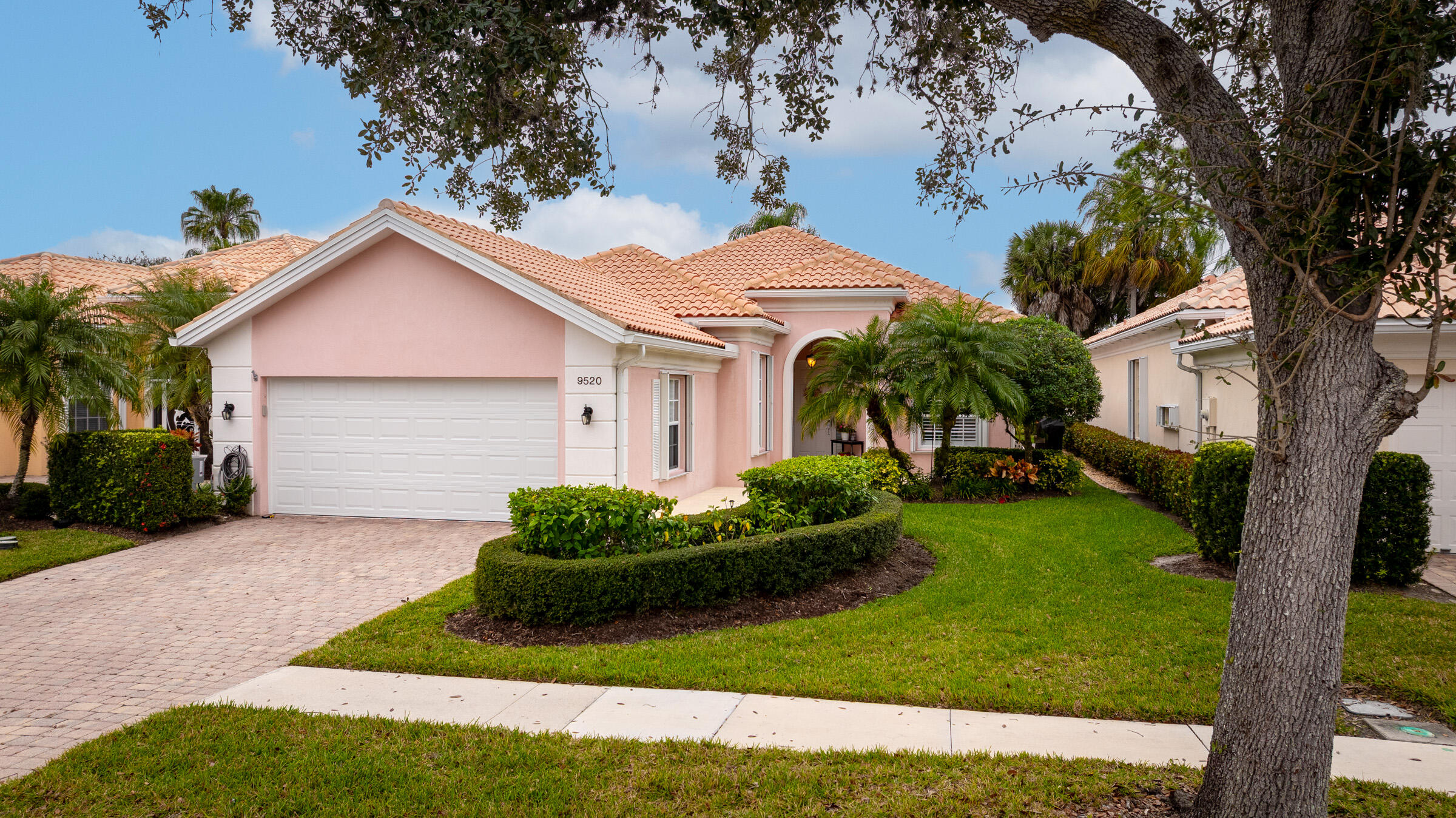 Welcome to The Florida Club, a gated golf community with the option of a membership, if desired.  This Beautiful Oakmont model is meticulous and move in ready!   The Oakmont offers 3 bedrooms, den / office, his & her primary baths with a shared shower and guest bathroom.  NEW ROOF installed in May 2022, NEW AC installed 2023, NEW HOT WATER HEATER INSTALLED 2022, NEW HURICANE RATED GARAGE DOOR & OPENER with smart phone capabilities.  Appliances are about 5 yrs old.  The living area has newer tile throughout, sizeable living room that flows into the dining area and kitchen.  The kitchen is open and perfect for entertaining with white cabinets, granite, newer stainless appliances, new faucet, and updated lighting.  The Primary Suite has tons of closet space, walk-in closet, ....... new cabinetry in his & her baths, as well as a fully renovated walk-in shower, granite countertops, new hardware & lighting, and soaking tub.  The 2nd & 3rd bedrooms are split from the primary suite with a shared bath that has been renovated as well.  New vanity, granite, glass sliding doors on tub, and lighting.  The office is placed at the front of the house and is the perfect space to work from home, to create a library or an additional TV room.  This home has crown molding throughout.   The laundry room has tons of cabinet space, drawers, and a laundry sink.  Additional features of this home include: Plantation shutters in kitchen, office and primary suite, Impact sliders in primary suite and dining area, screened patio with golf views and an additional electric screen for inclement weather, paver driveway, walking path around the home with grill space on the side, central vacuum, and attic pull down stairs.  This community is pristine and very welcoming.  It is located just west of I-95 for easy interstate access.