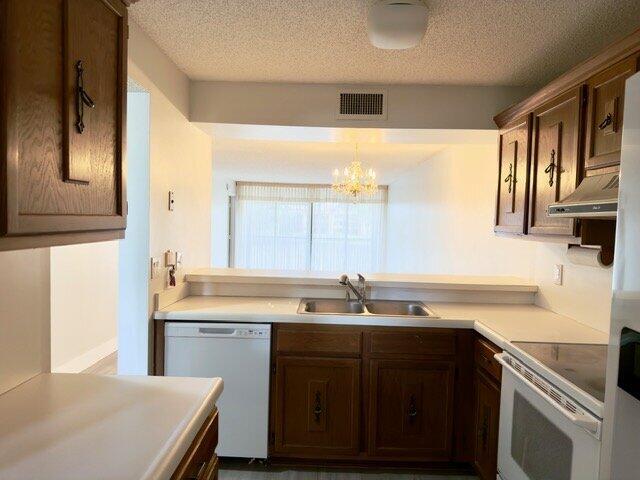 Welcome to Coral Gate! A beautifully sought after, lively 55+ waterfront community. In unit washer & dryer. This clean 2nd floor 2 bedroom 2 bath condo is in move-in condition. Available for immediate occupancy subject to HOA approval. New molding and vinyl flooring, freshly painted, and features a beautiful lake view. The community is conveniently located near HCA Florida Northwest Hospital and Broward Health Coral Springs, providing easy access to major medical services and emergency care. Coral Gate Park is located next door and features three half-court basketball courts, two full-size tennis courts, six pickleball courts, covered sitting areas, covered playgrounds, restrooms, and a rentable pavilion. Community requirements include a minimum 15 percent down payment for financing, a  minimum 650 credit score, and a two-year ownership period prior to renting. A roof project is already scheduled to begin this year with no special assessment, as it is fully accounted for in the budget. The primary suite includes a private bath, while the second bedroom is perfect for guests or a home office. Enjoy indoor-outdoor living with serene water views right from your porch—ideal for relaxing or entertaining. Conveniently located near shopping, restaurants, medical and the Coconut Creek​​‌​​​​‌​‌​​​‌‌​​​‌‌‌​​‌​​‌‌​​​​ Casino