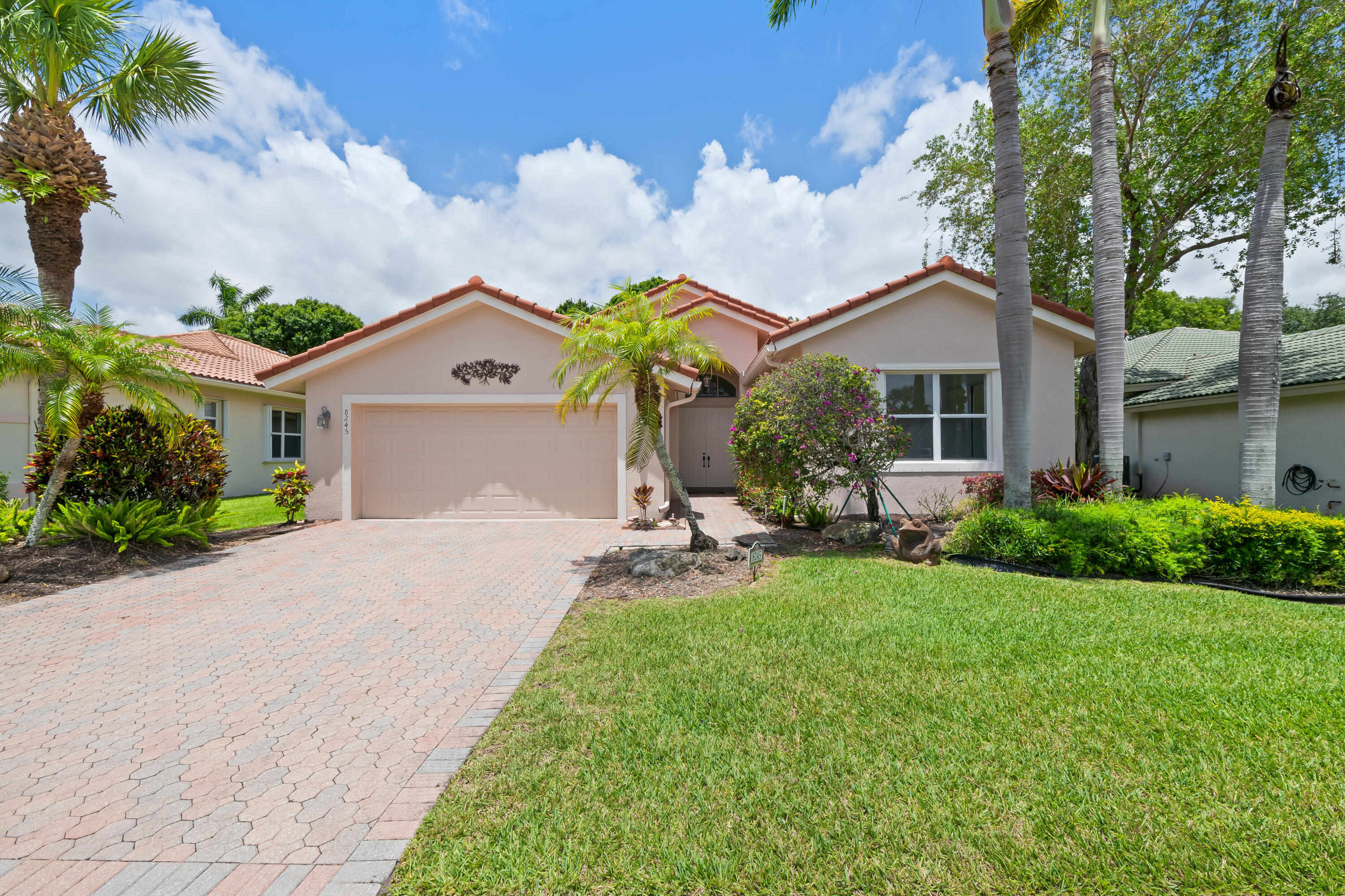 Welcome to Valencia Isles, a gated 55+ active lifestyle community! This fully updated 4BR/3BA home features waterproof vinyl flooring throughout, a modern kitchen with shaker cabinets, quartz countertops, and stainless steel appliances. All bathrooms have been beautifully renovated with new tile, vanities, and fixtures. The spacious primary suite offers two walk-in closets, a soaking tub, and separate shower. Triple-split floor plan includes a secondary ensuite bedroom with walk-in closet, ideal for guests. Volume ceilings and a formal dining room/flex space add versatility. A/C replaced in 2025. HOA includes internet, cable, landscaping, and sprinklers. Pets welcome; rentals permitted after 1 year. Resort-style amenities: tennis, pickleball, pools, fitness, sauna, restaurant and more.