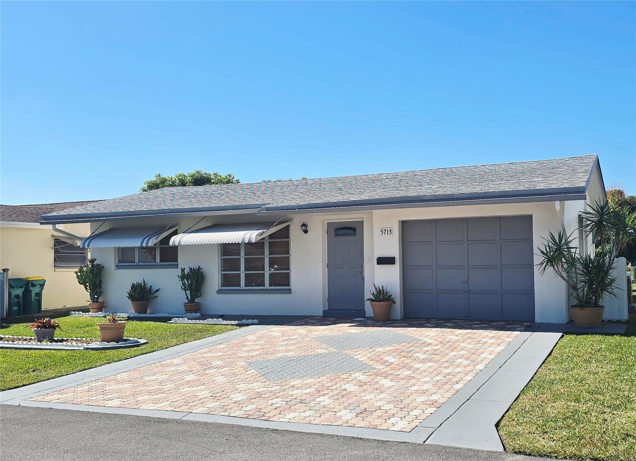 Discover this charming and well-maintained single-family home for rent in the Mainlands of Tamarac 55+ community. Featuring 2 bedrooms, 1 full bathroom, a 1-car garage, a spacious family room, and an enclosed patio, this cozy home is surrounded by beautiful green spaces that create a peaceful, relaxing atmosphere.Enjoy an active lifestyle with access to the community pool and clubhouse, all while being just minutes from shopping, dining, and major highways. Move-in ready and easy to show—this is comfort, convenience, and community all in one. Age-restricted community: At least one occupant must be 55+. No residents under 18 per association rules.